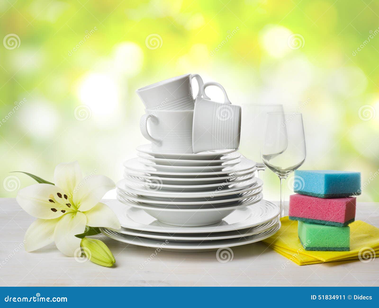 Clean Tableware, Dishwashing Sponges and Lily Flower Over Abstract