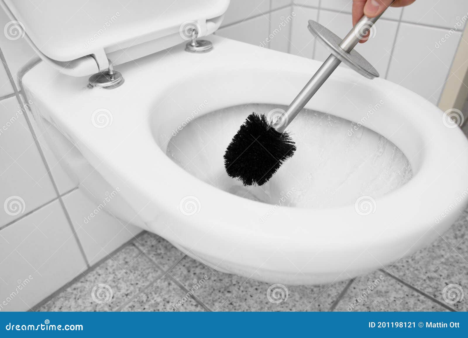 Clean The Toilet With A Toilet Brush While Flush Stock Image