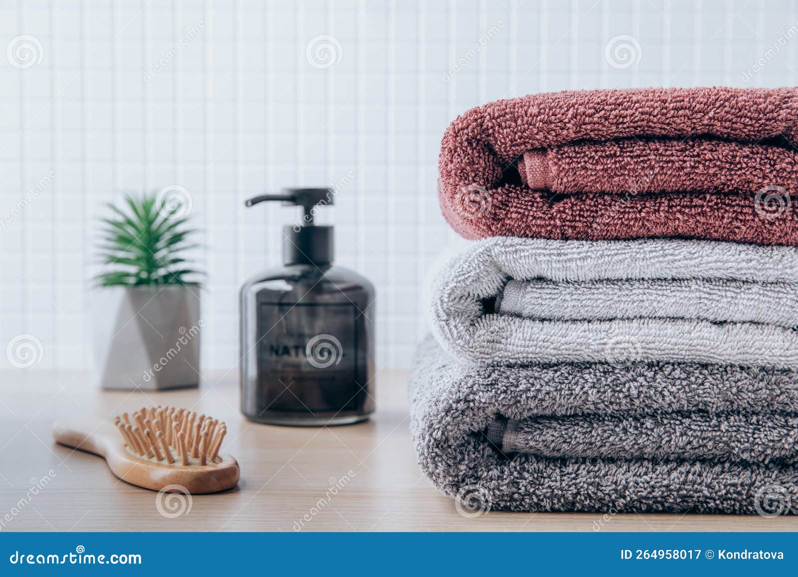 Towels. Clean Fresh Fluffy Towels and Bath Accessories on Table in