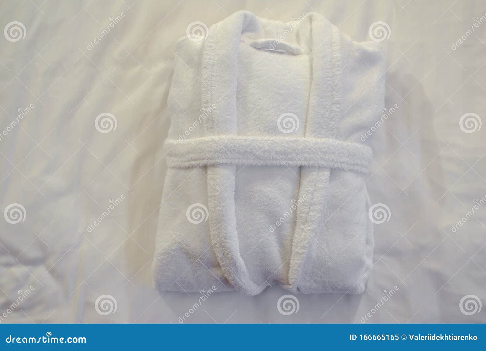 Clean Folded Bathrobe on White Bed. Stock Image Image of beauty