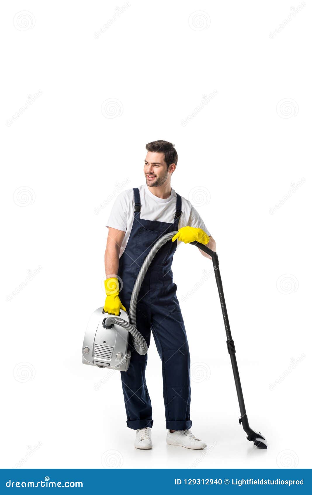 Cleaner in Uniform and Rubber Gloves with Vacuum Cleaner Stock Photo