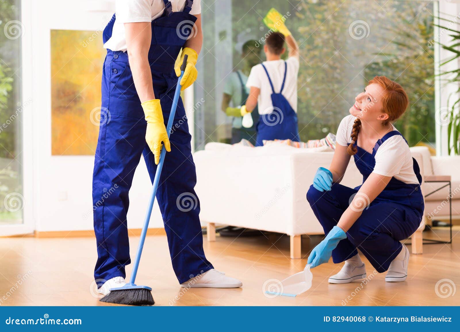 Cleaners sweeping floor stock photo. Image of gloves 82940068