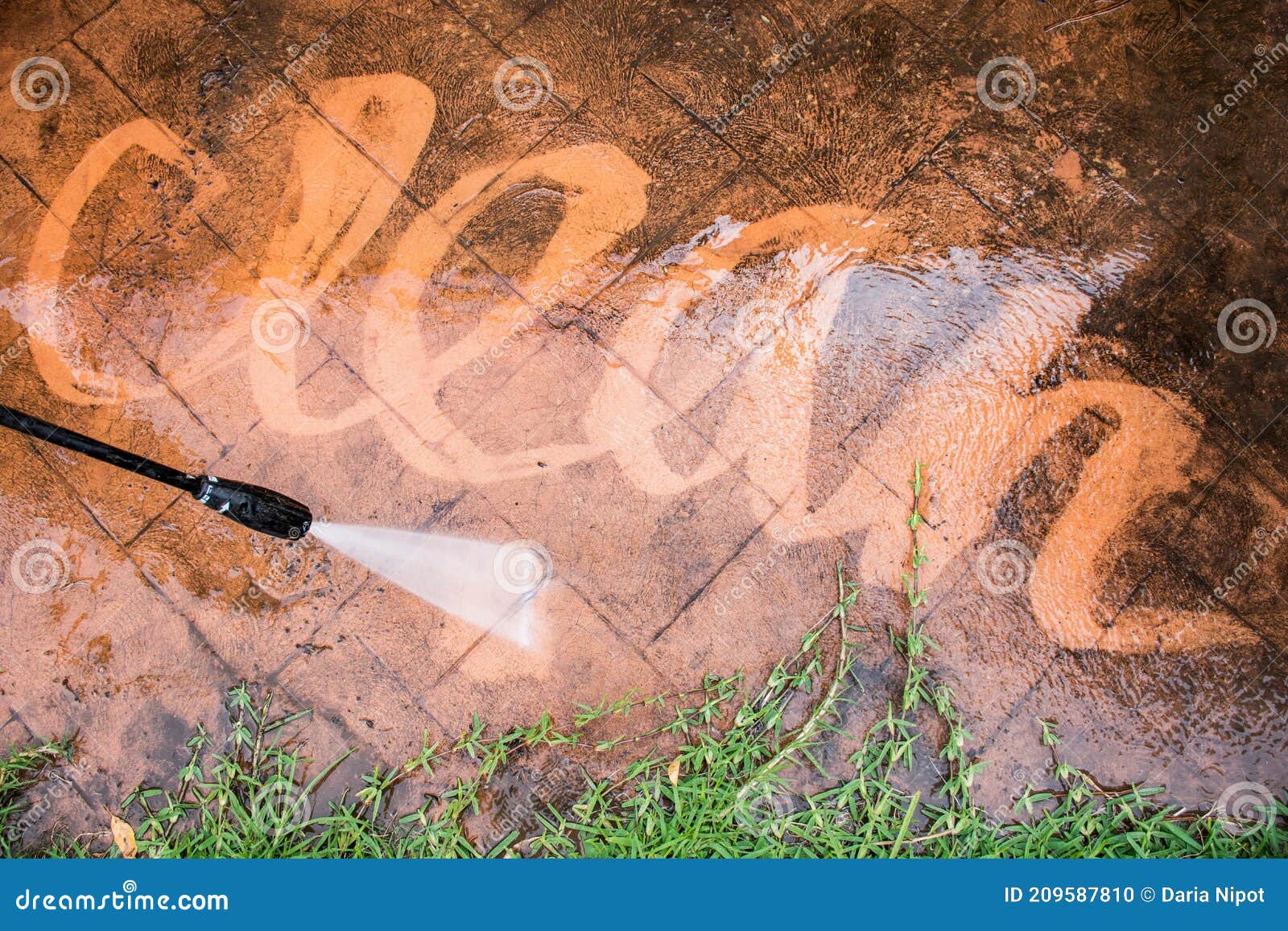 Cleaning Backyard Paving Tiles with Pressure Washer Stock Photo Image