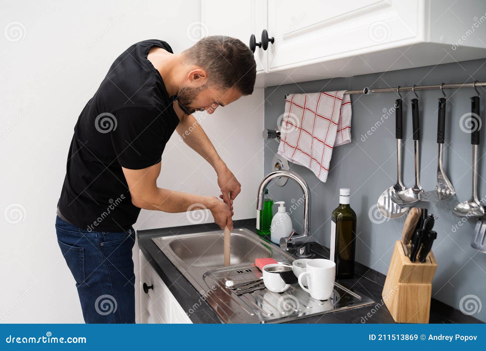 cleaning blocked drain clog in kitchen sink