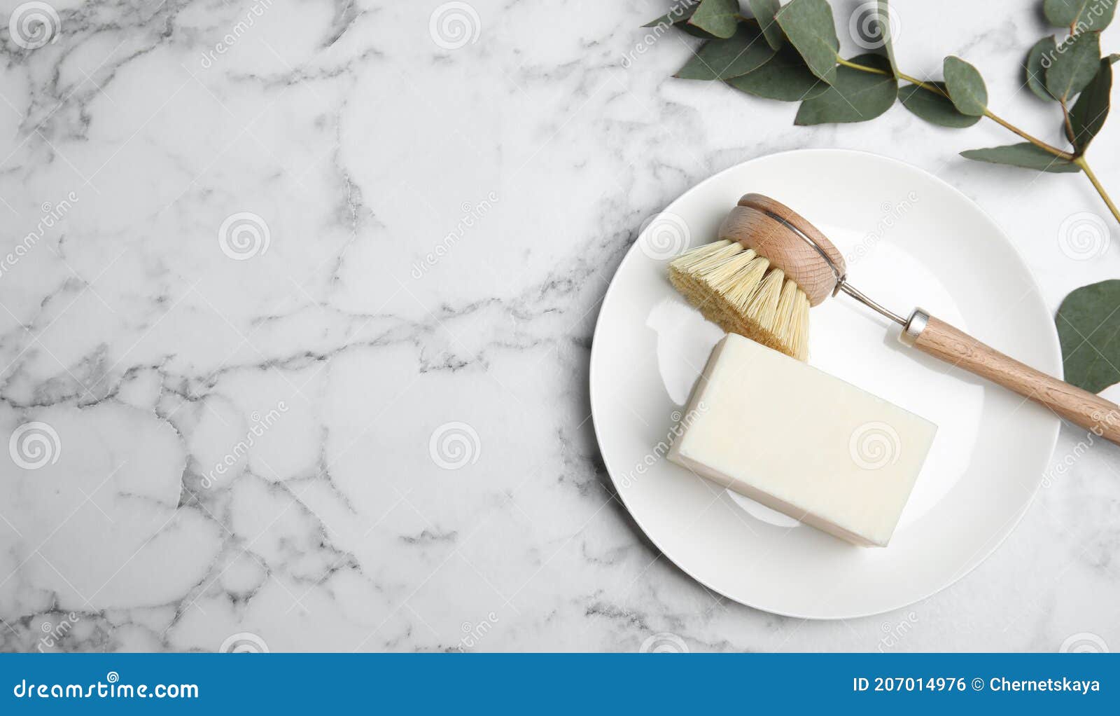 Cleaning Brush, Soap Bar and Plate on White Marble Table, Flat Lay