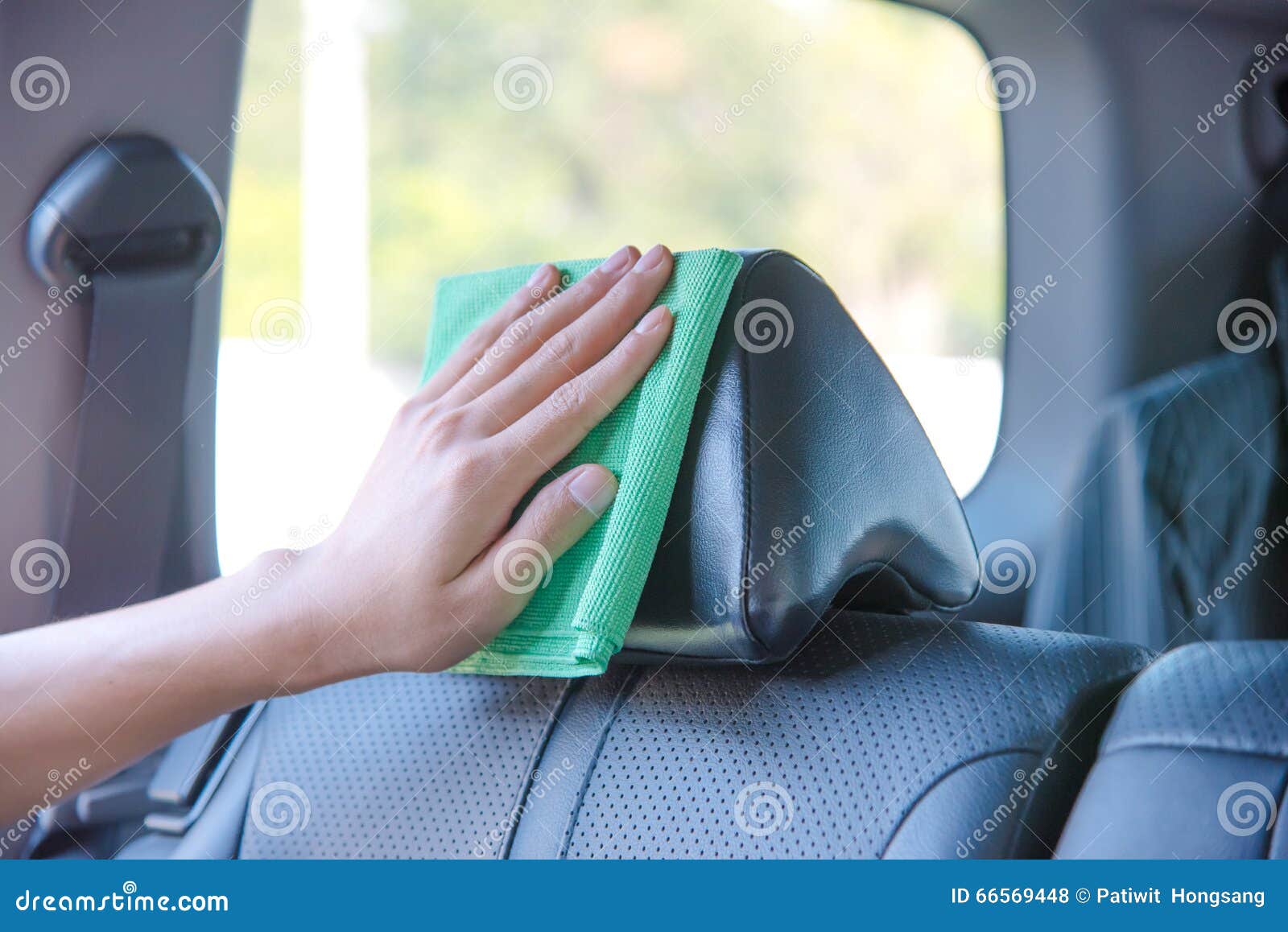 Cleaning the Car Interior with Green Microfiber Cloth Stock Photo