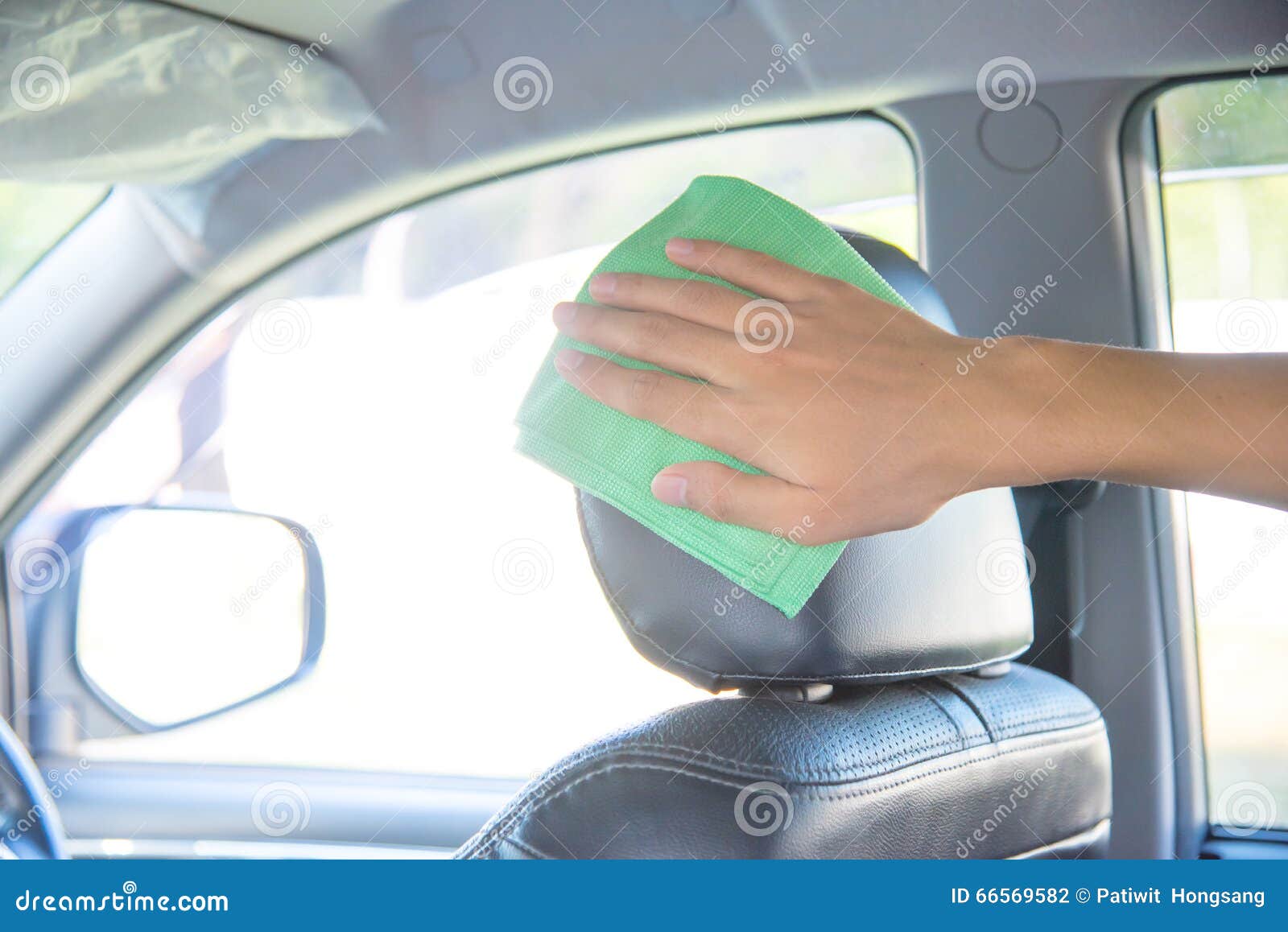 Cleaning the Car Interior with Green Microfiber Cloth Stock Photo