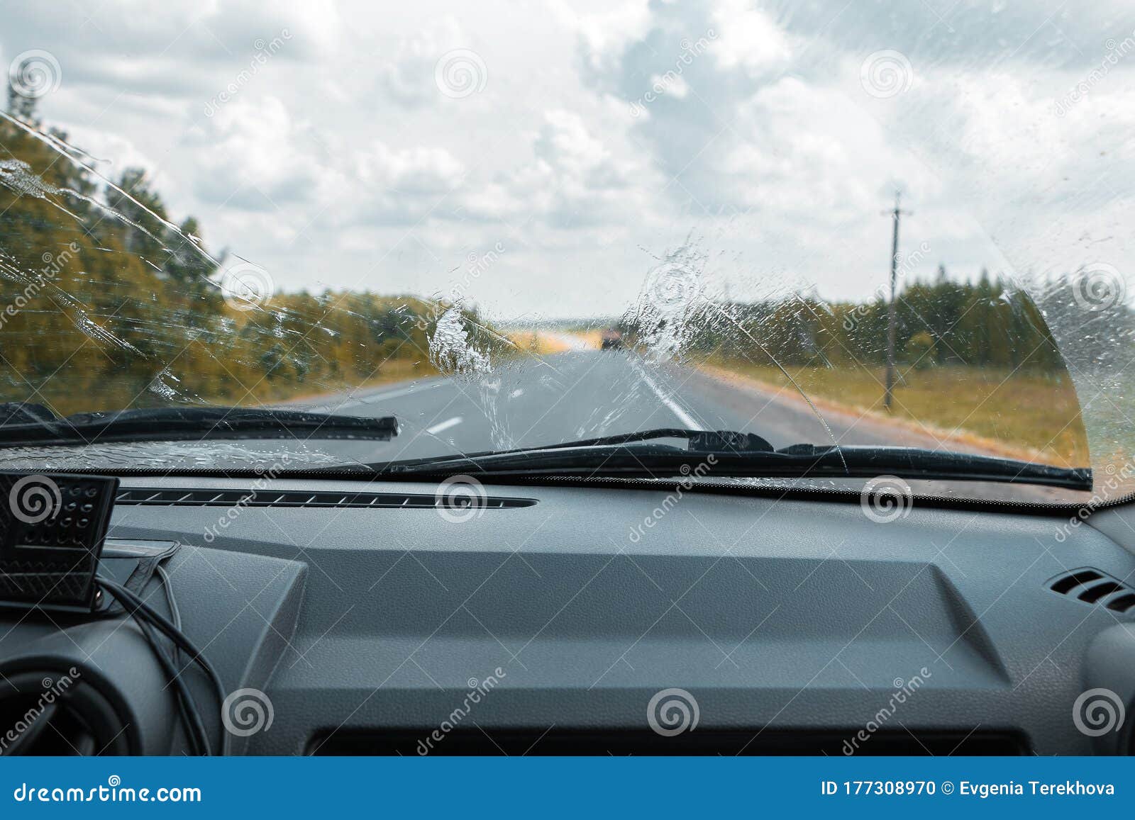 Cleaning the Car`s Windshield with a Windscreen Wiper Stock Photo