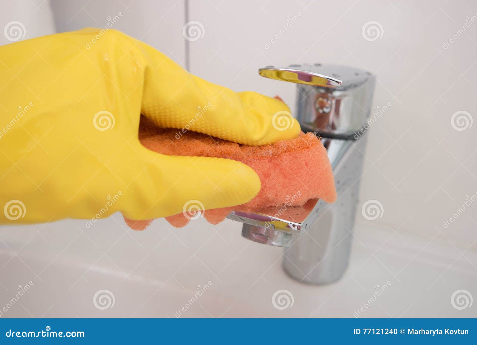Cleaning Chrome Faucet with a Sponge Close Up. Stock Photo Image of