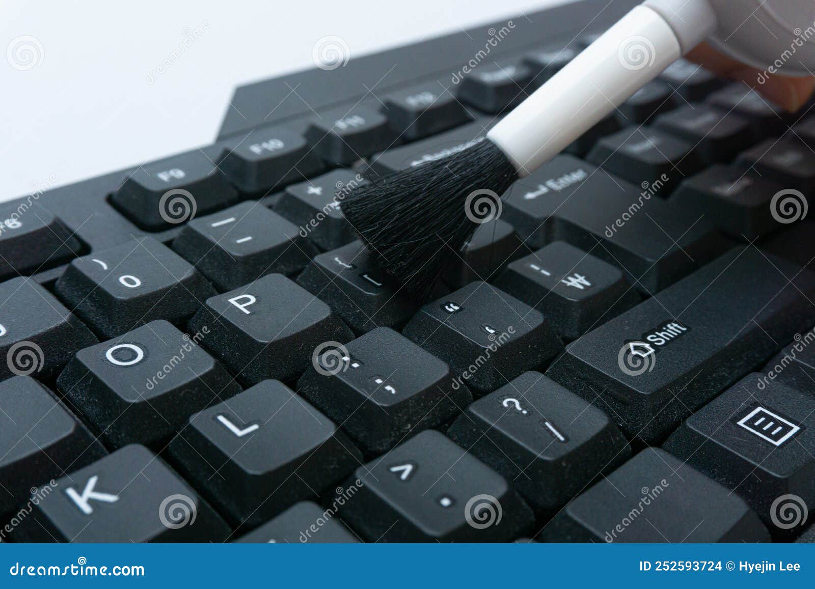Cleaning computer keyboard stock photo. Image of desktop 252593724
