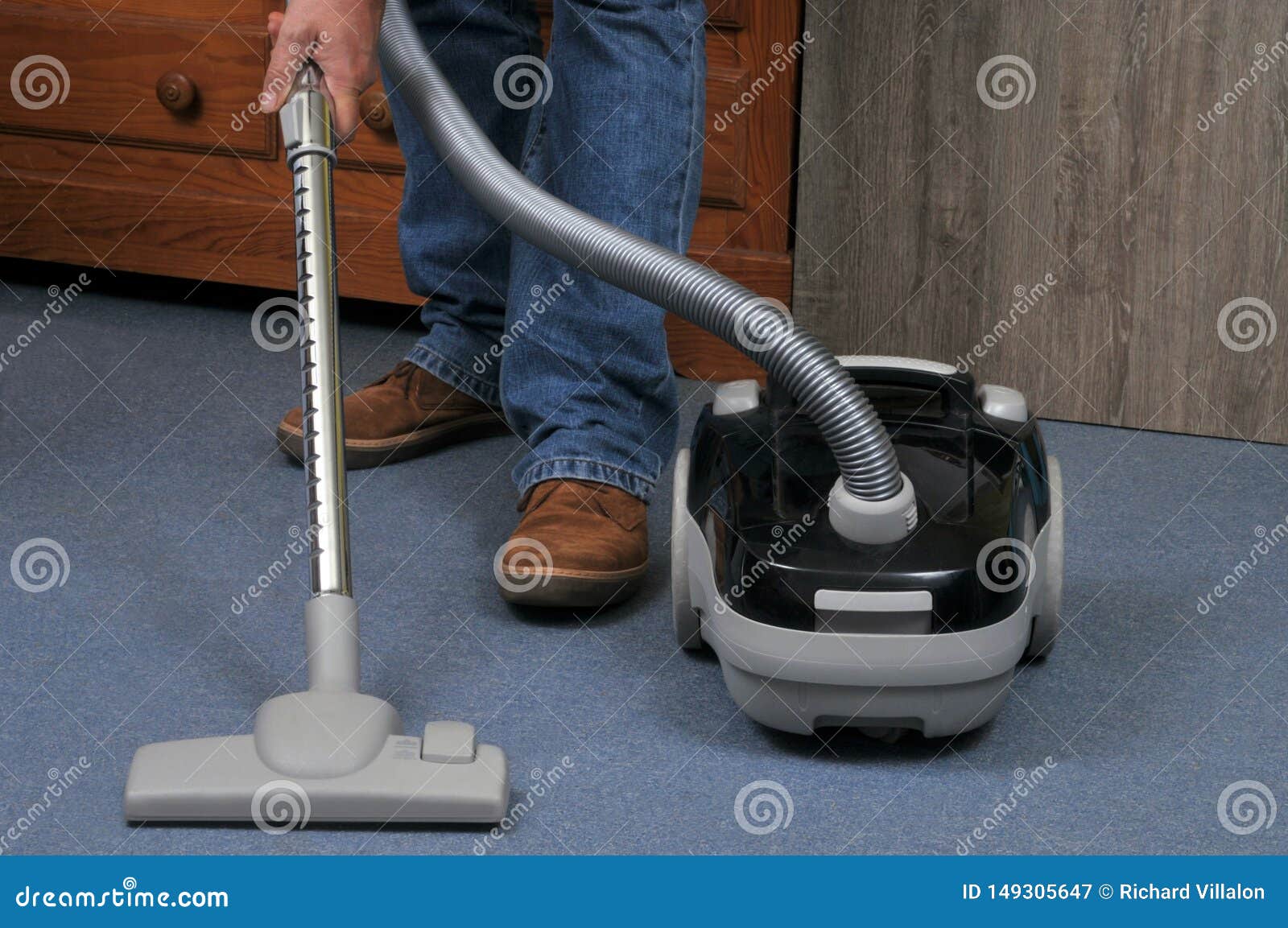 Vacuuming the carpet stock image. Image of drudgery 149305647