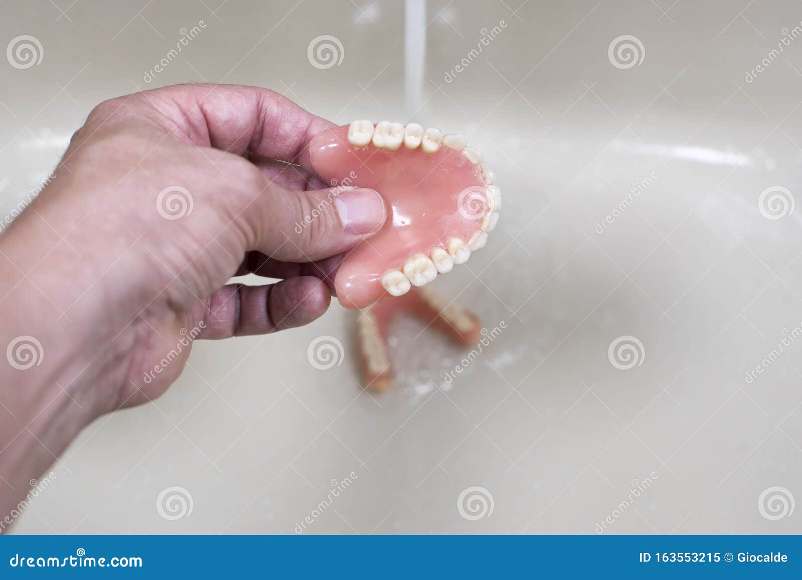 Cleaning of the denture stock image. Image of orthodontic 163553215