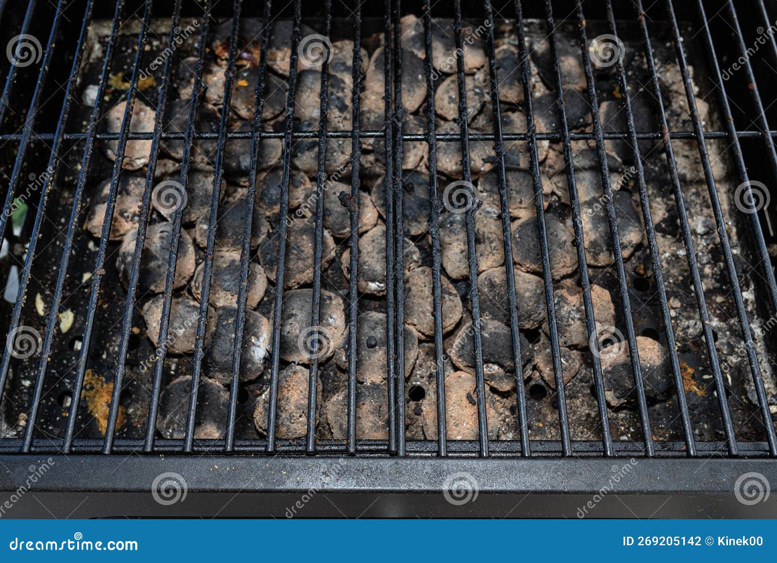 Cleaning a Dirty Grill while Standing on the Terrace and Emptying the
