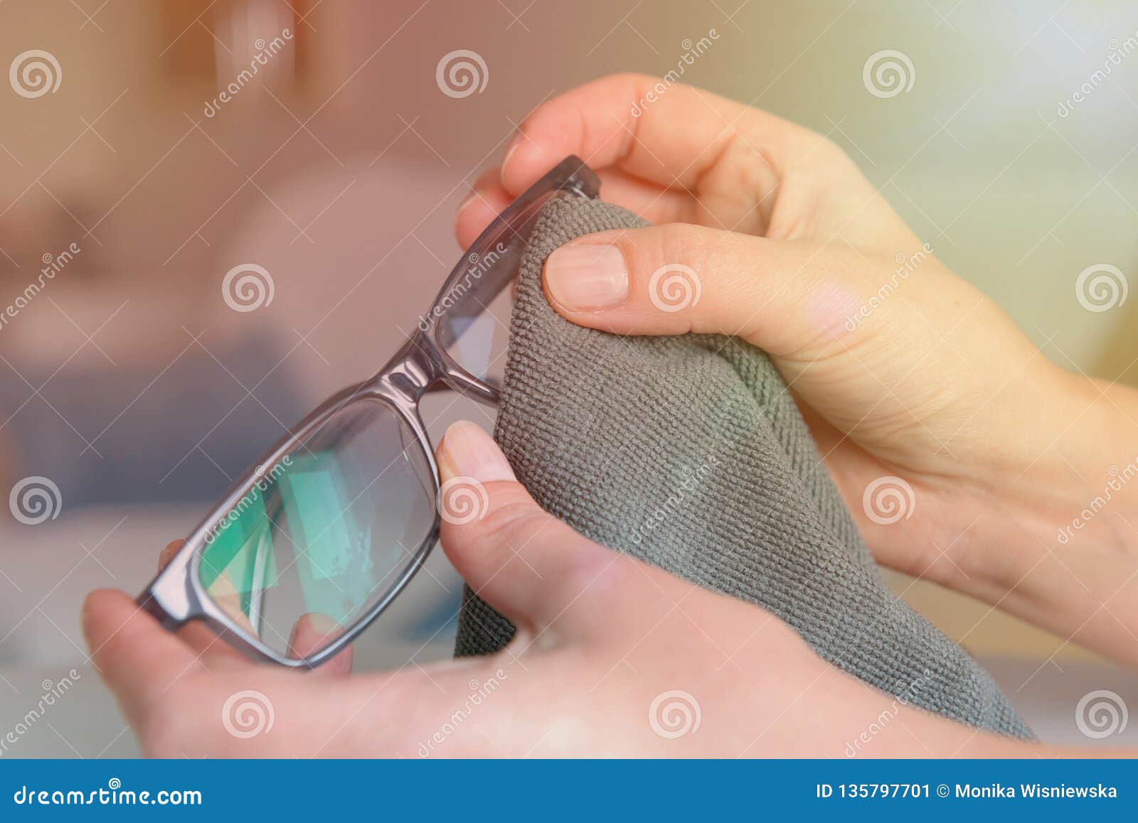 cleaning eyeglasses with microfiber cloth