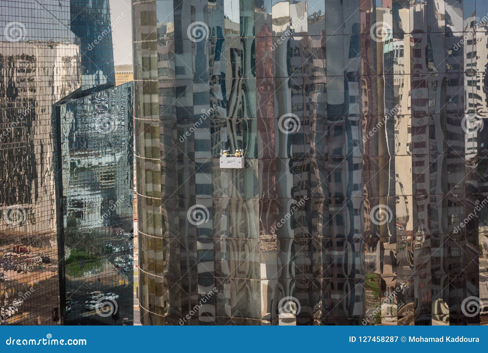 Cleaning Glass Tower Windows in Abu Dhabi City Editorial Photography