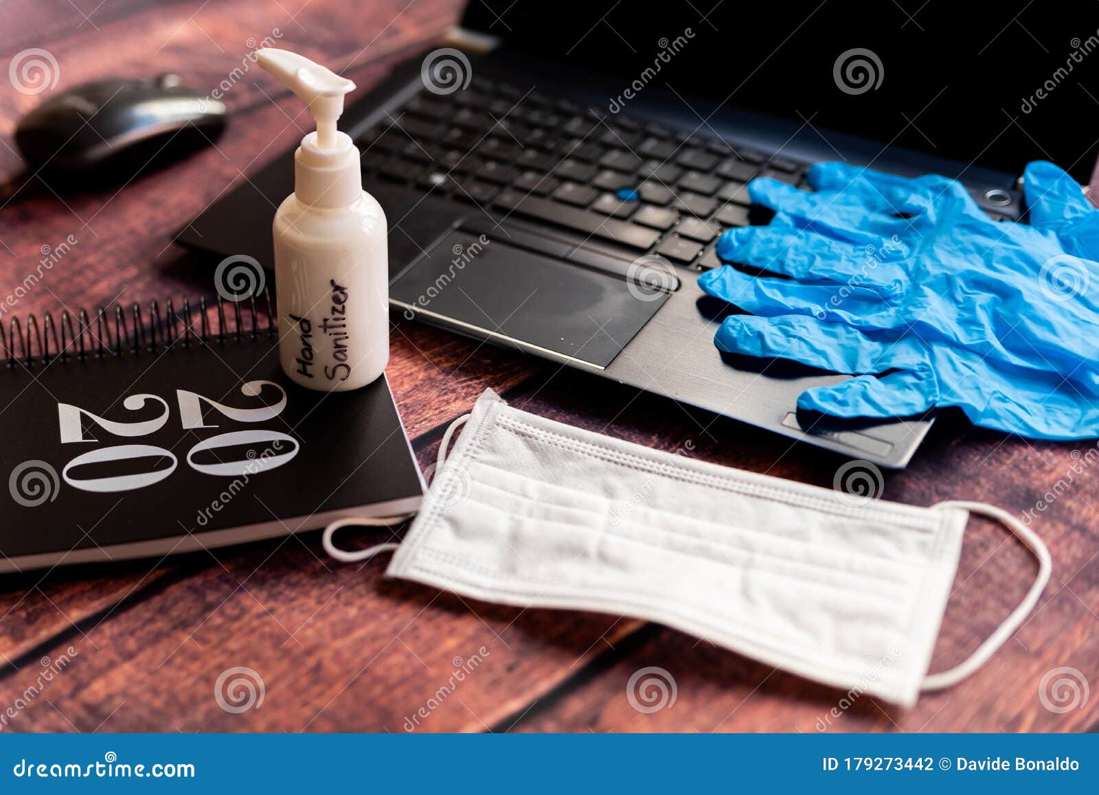 cleaning kit for remote work home office desk with hand sanitizer and face mask, a solution against the spread of corona virus for