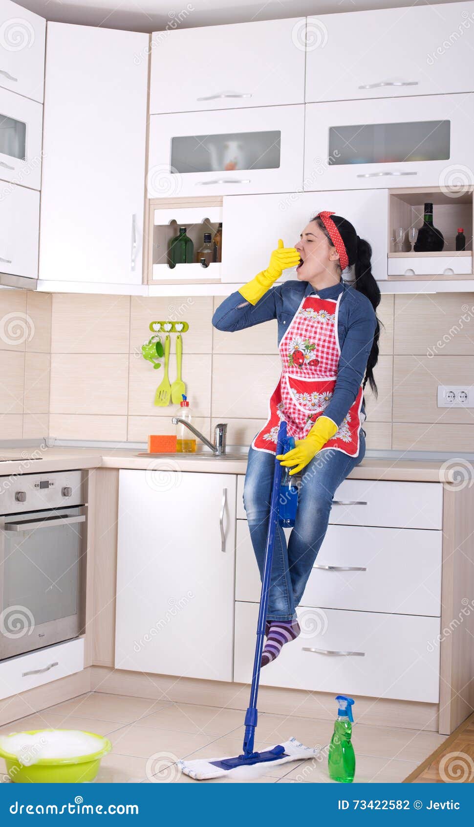 Cleaning Lady Restng On Kitchen Countertop Stock Photo Image Of