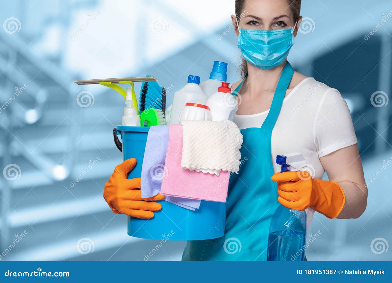 cleaning lady with tool in cleaning in mask