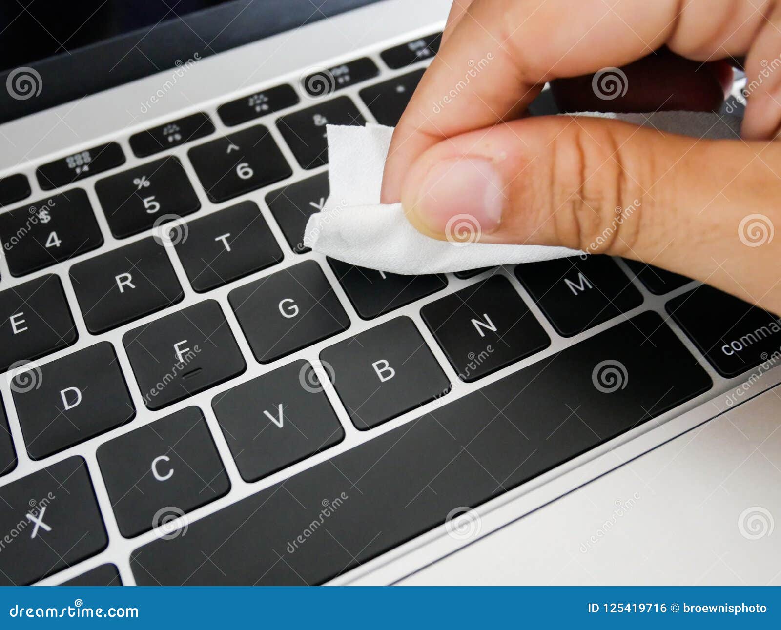 Cleaning Laptop Keyboard with Cleaning Cloth Stock Photo - Image