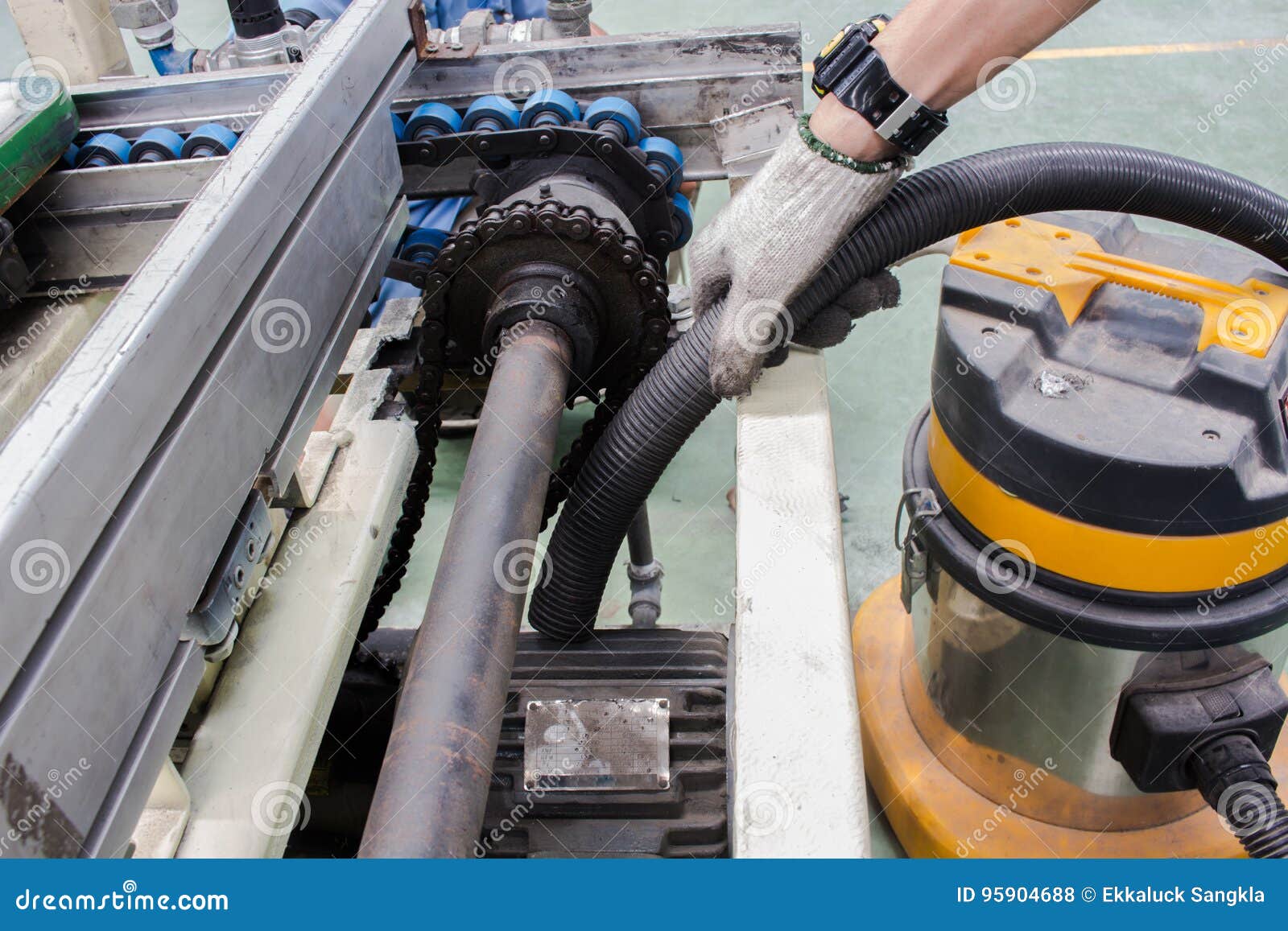 The Cleaning and Maintenance Motor Conveyor Chain Drive Stock Photo