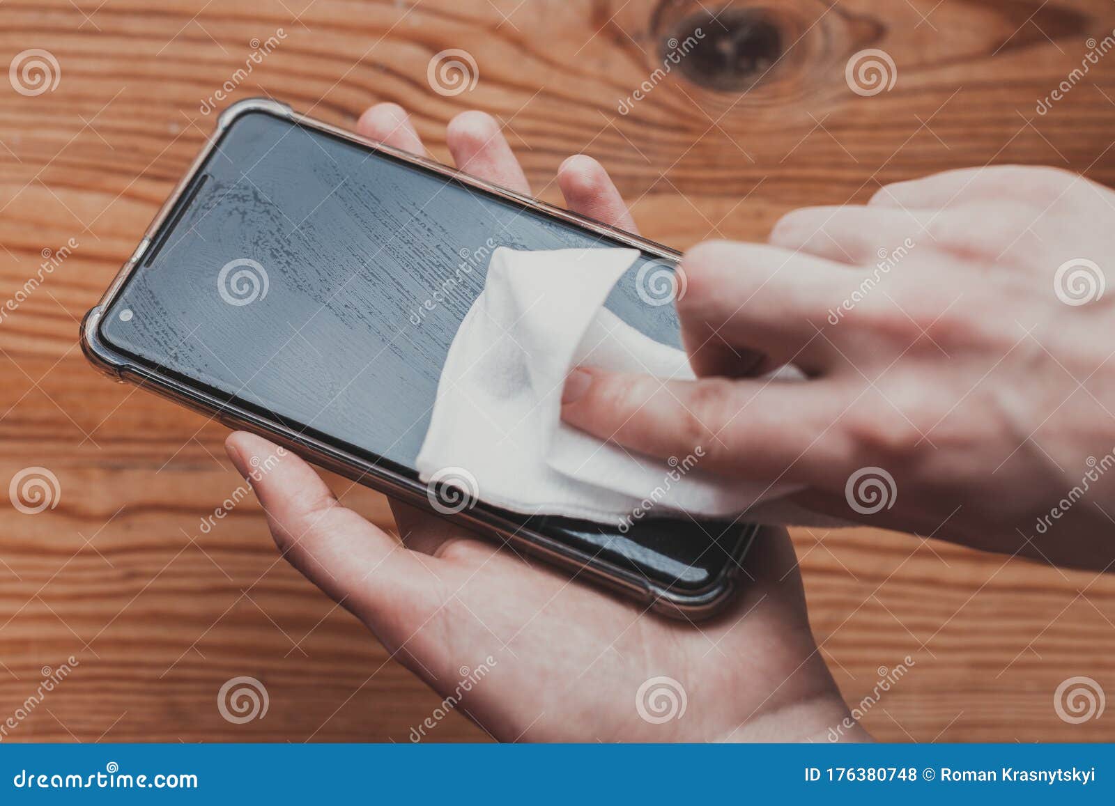 Cleaning Mobile Phone Screen with Disinfecting Wet Wipes for Clean