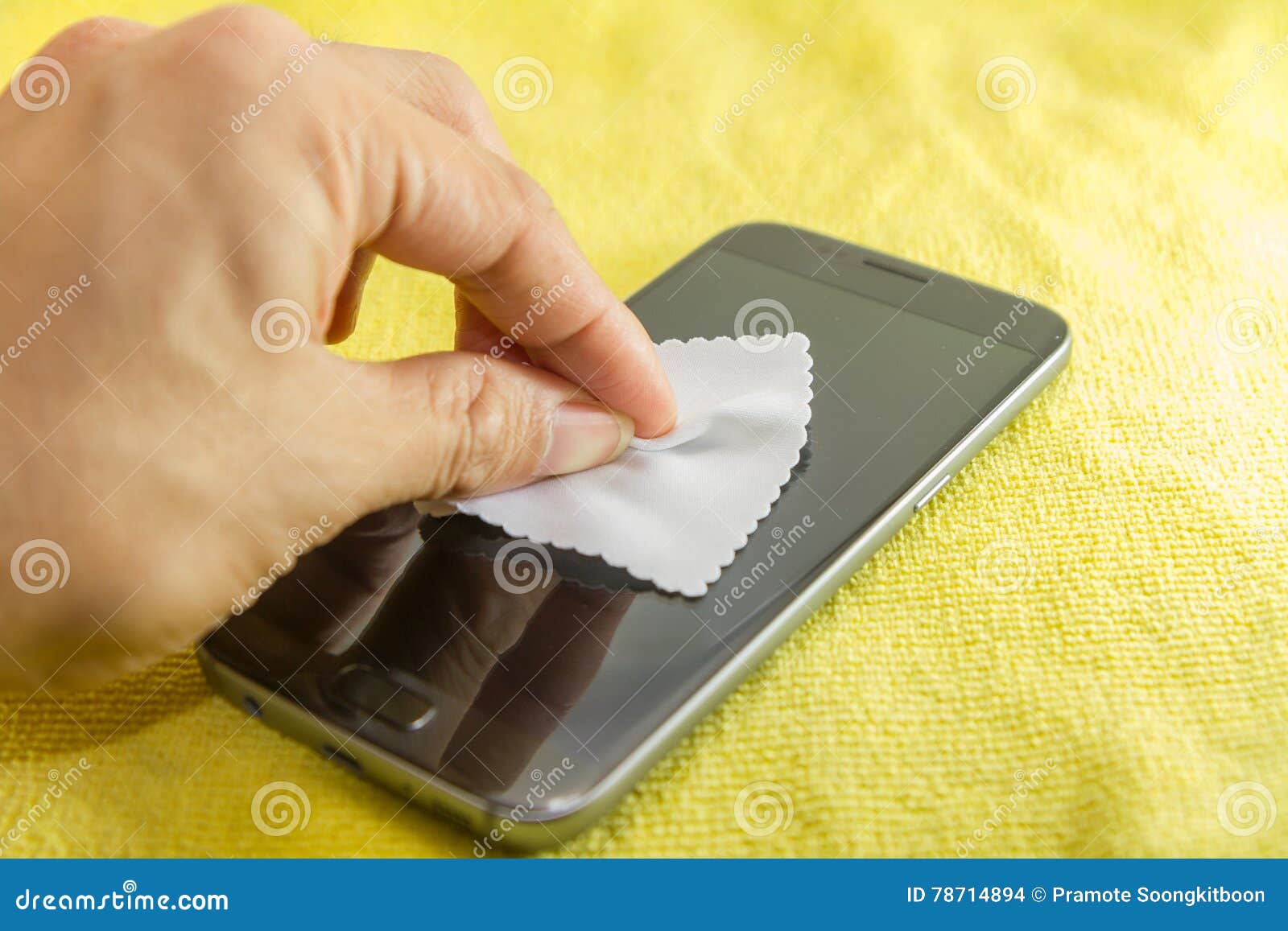 Cleaning Mobile Phone Screen by Microfiber Cloth. Stock Photo