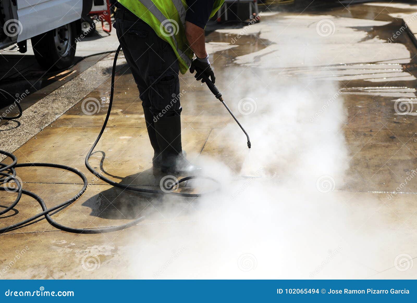 disinfection coronavirus, cleaning the pavement of the street with pressurized water