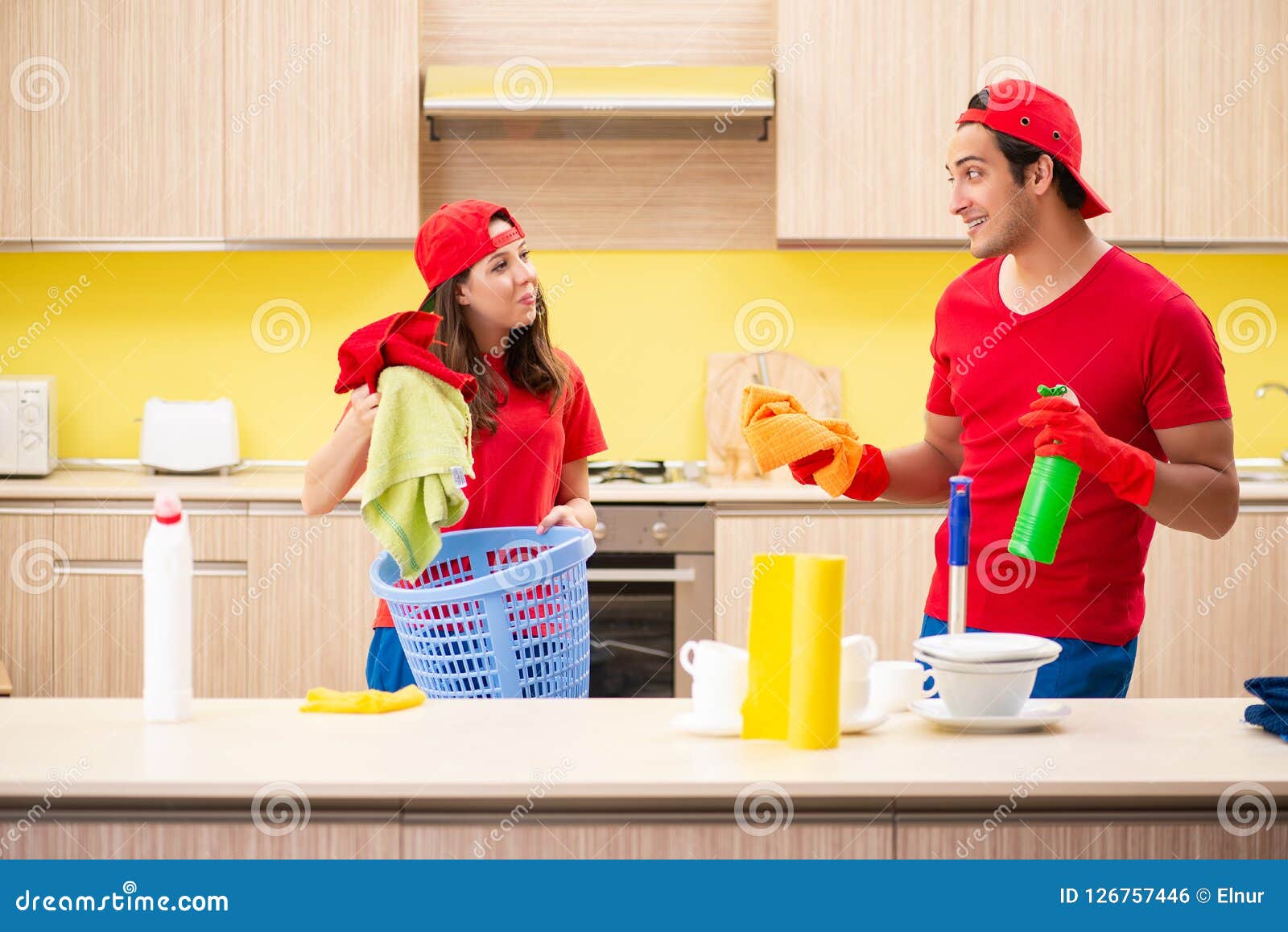 The Cleaning Professional Contractors Working at Kitchen Stock Photo