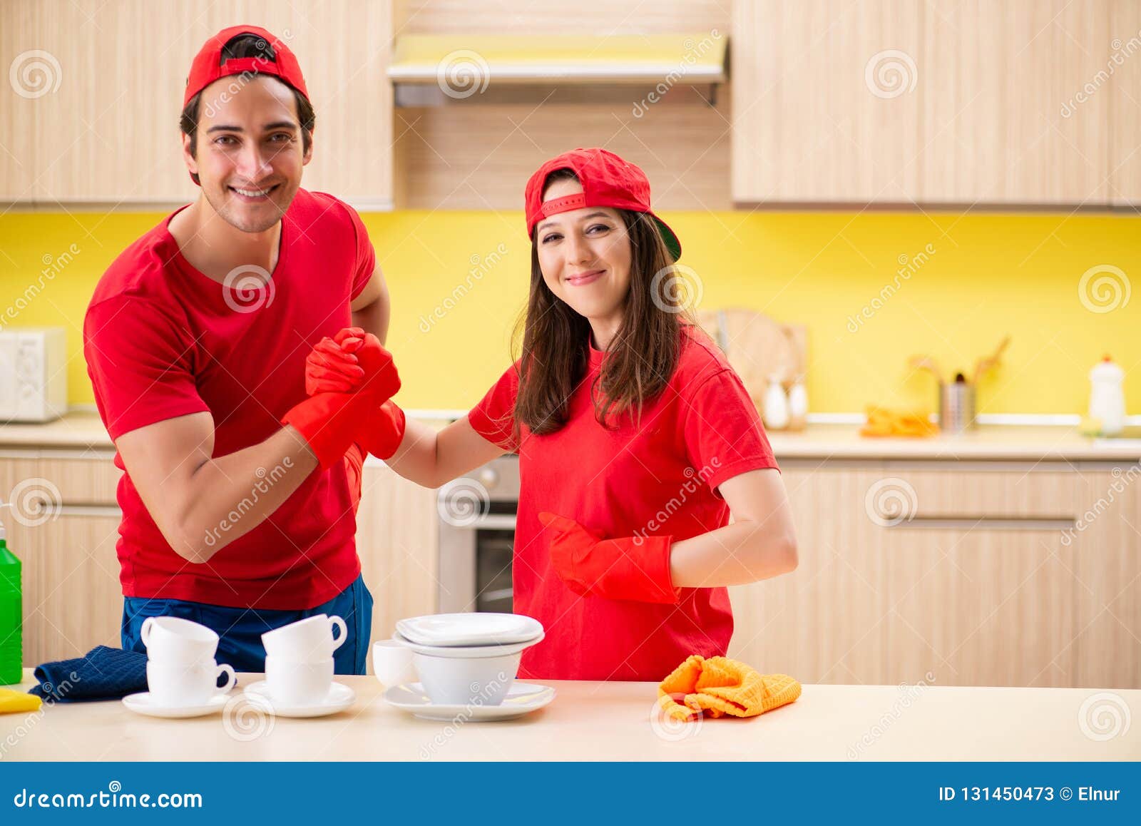 The Cleaning Professional Contractors Working at Kitchen Stock Image