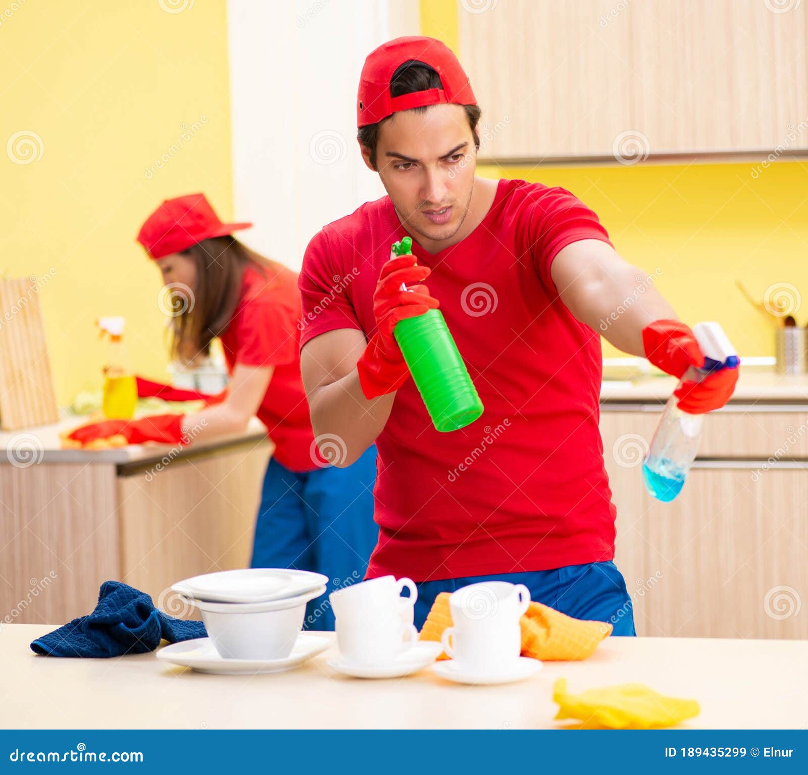 Cleaning Professional Contractors Working at Kitchen Stock Image