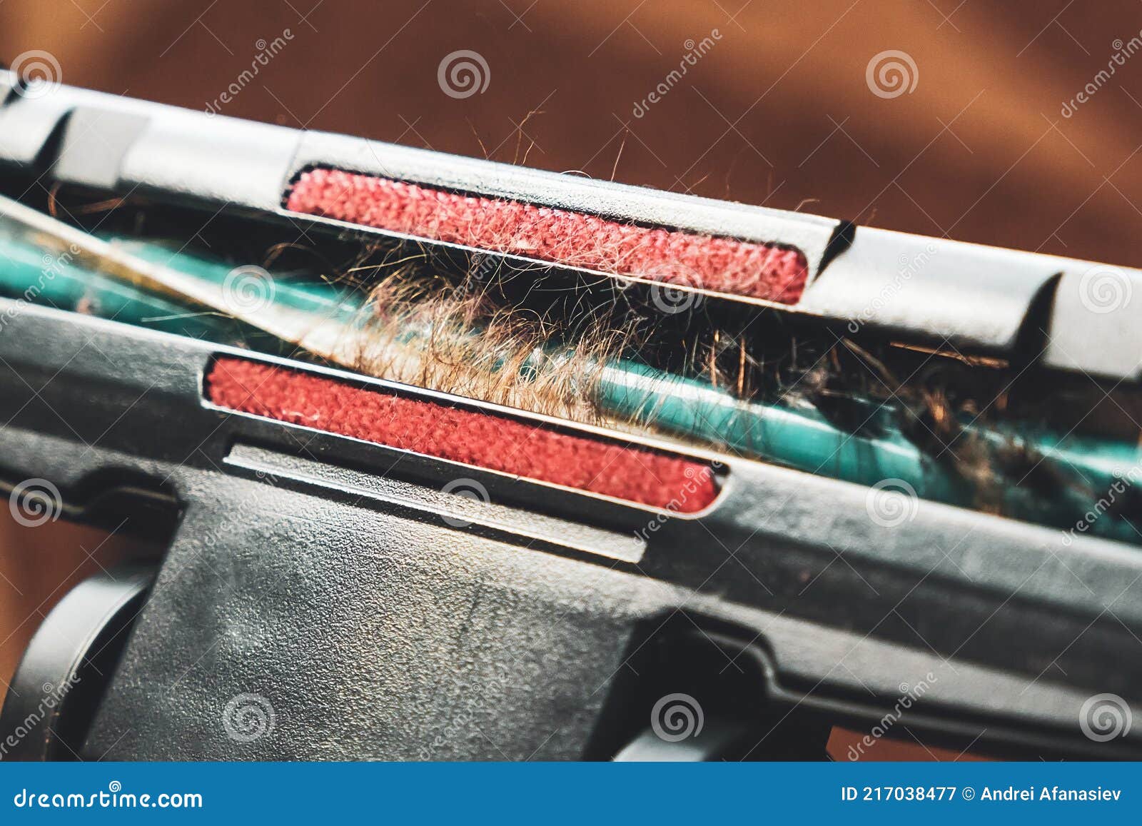 cleaning the room, long hair wrapped around a vacuum cleaner`s turbo brush