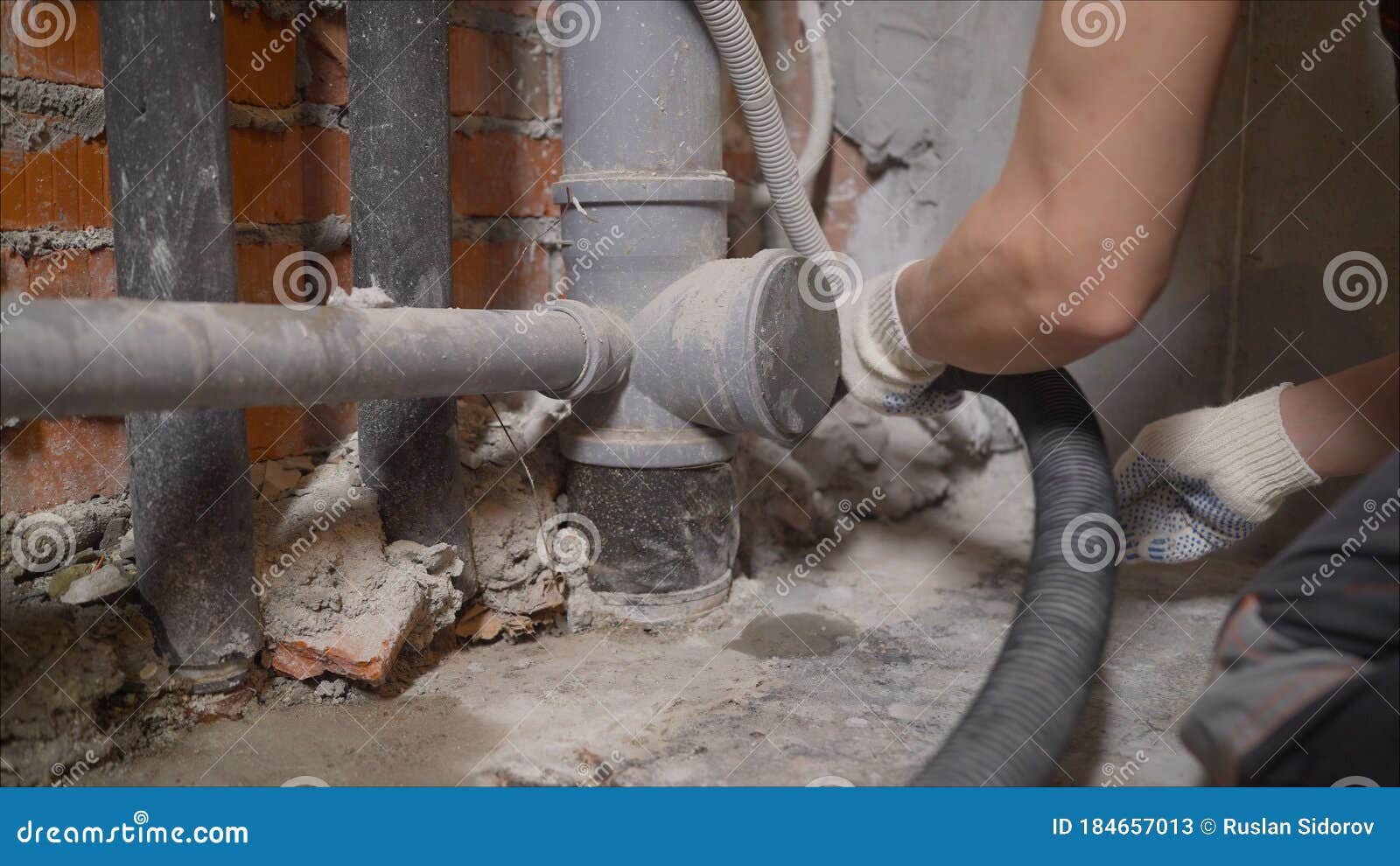 Cleaning Service. Dust Removal With Vacuum Cleaner. A Worker Removes Building Dust With A Vacuum How To Clean Up Concrete Dust