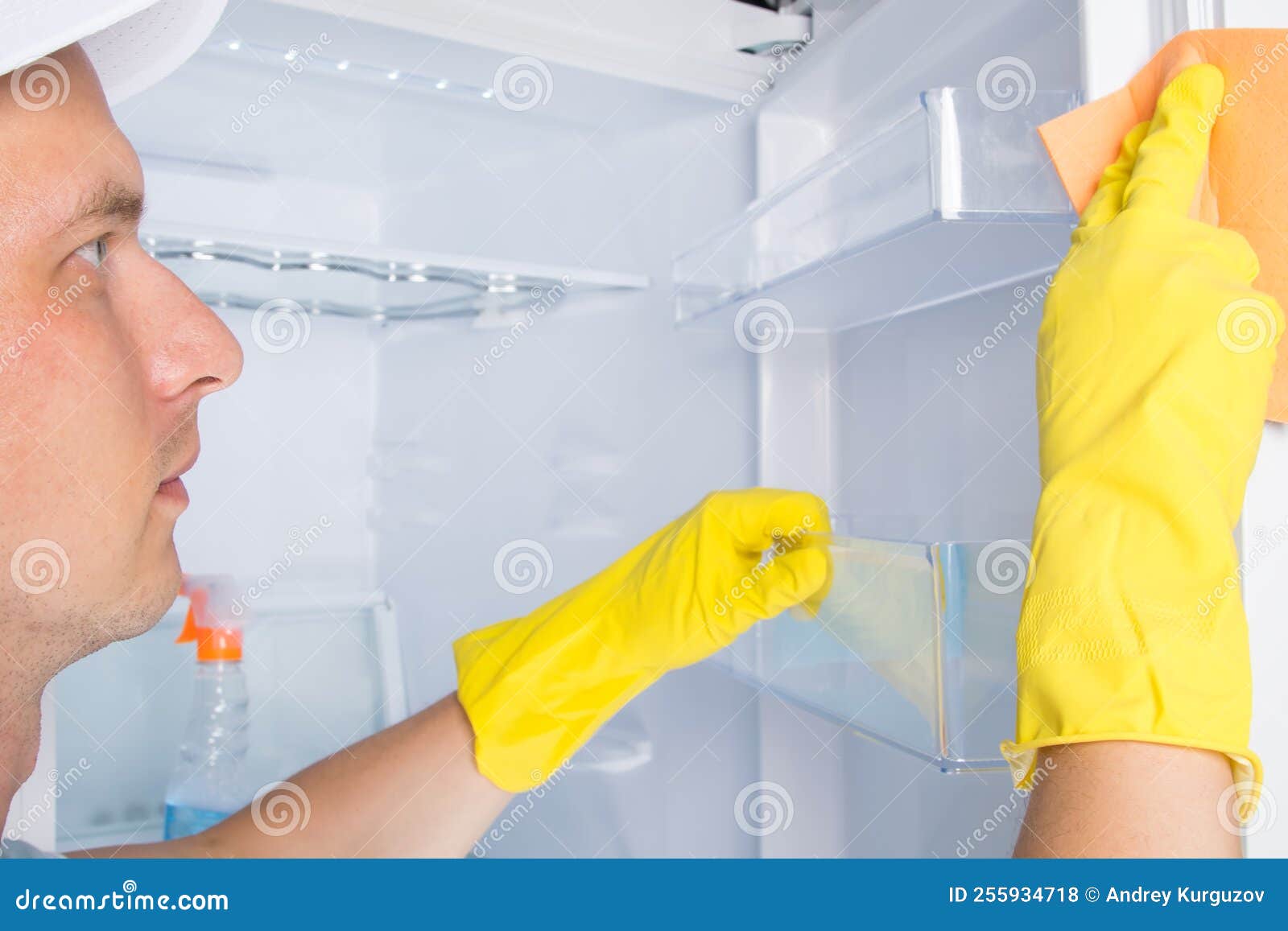 Cleaning Service Worker, Engaged in Cleaning the Refrigerator Stock