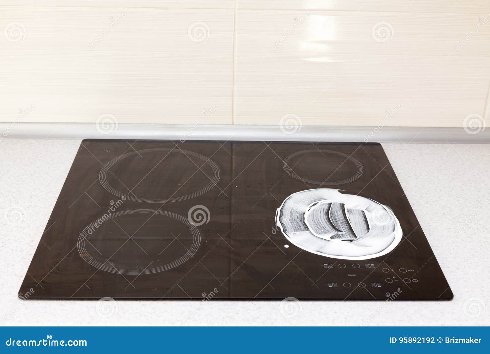 Cleaning Settop Stove with Cleaning Fluid and Leaving Detergent Trails