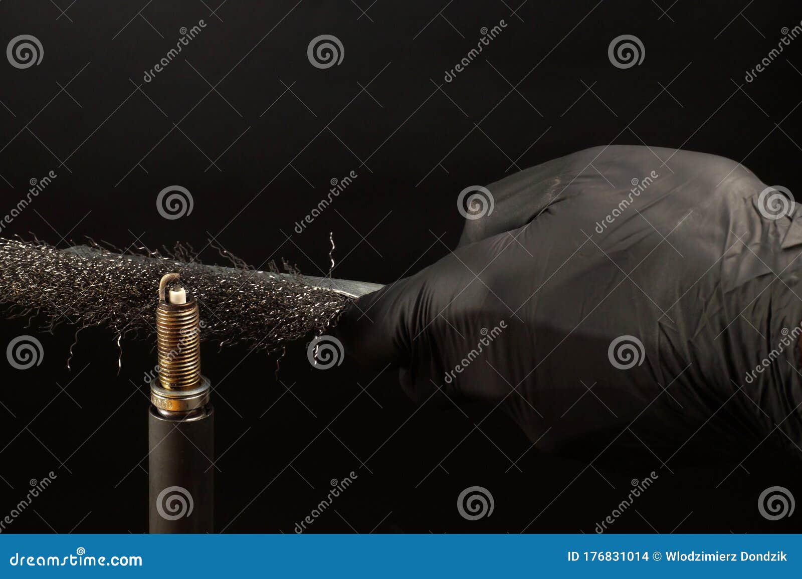 Cleaning the Spark Plug Thread with a Wire Brush. Internal Combustion