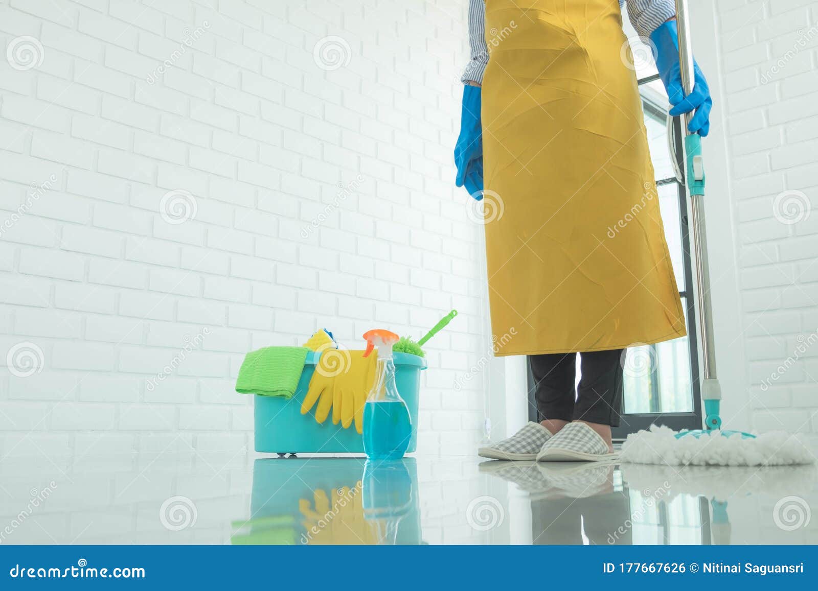 The Cleaning Staff Use Mops on the Surface and Use Cleaning Agents