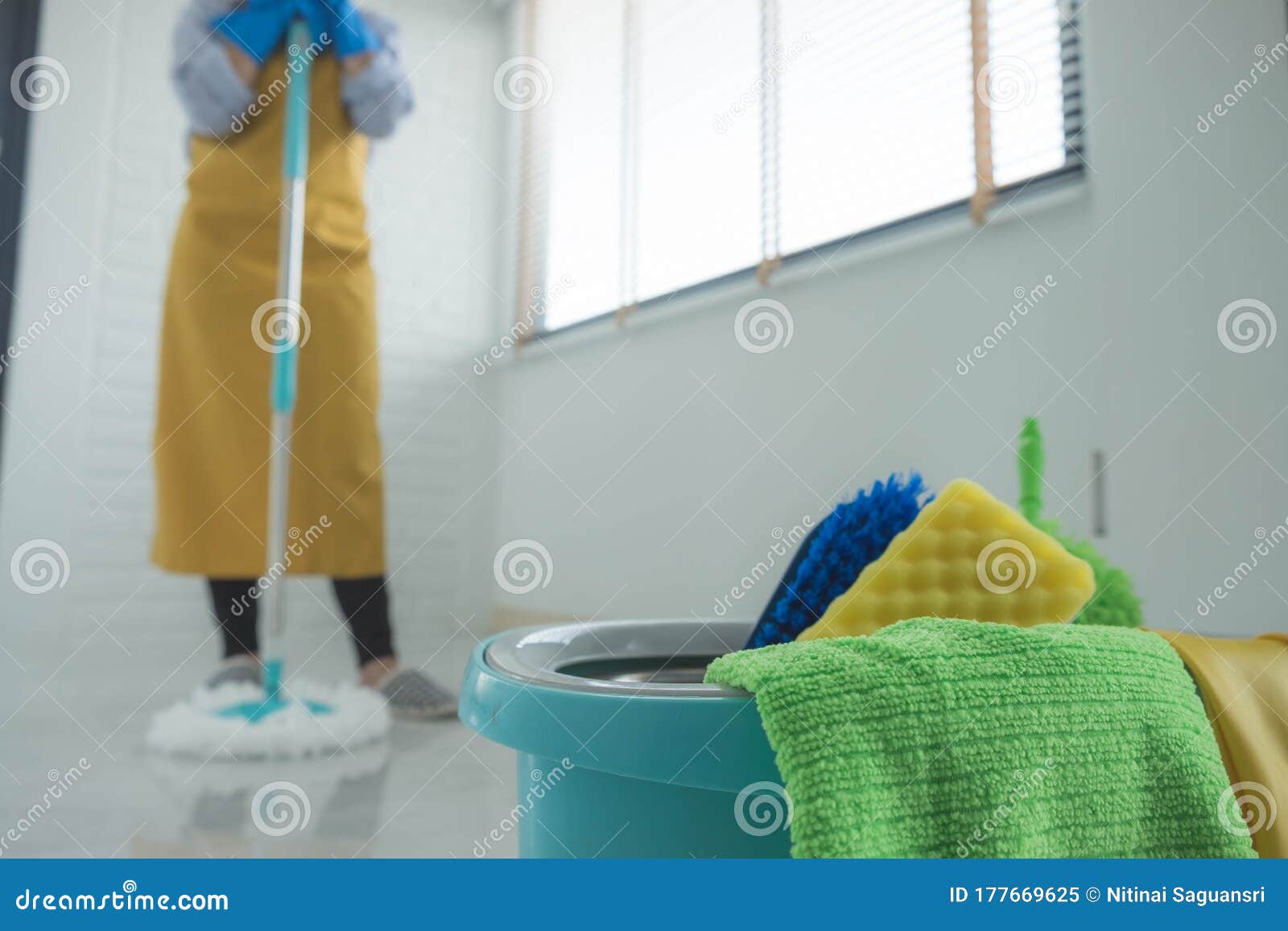 The Cleaning Staff Use Mops on the Surface and Use Cleaning Agents