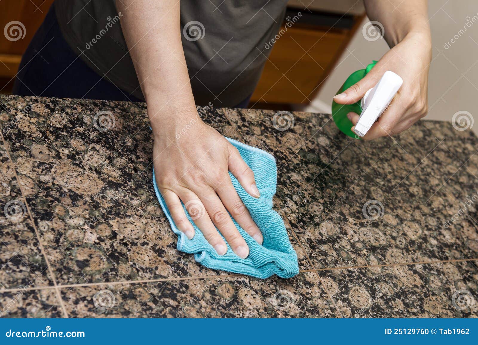 cleaning stone counter-top in kitchen