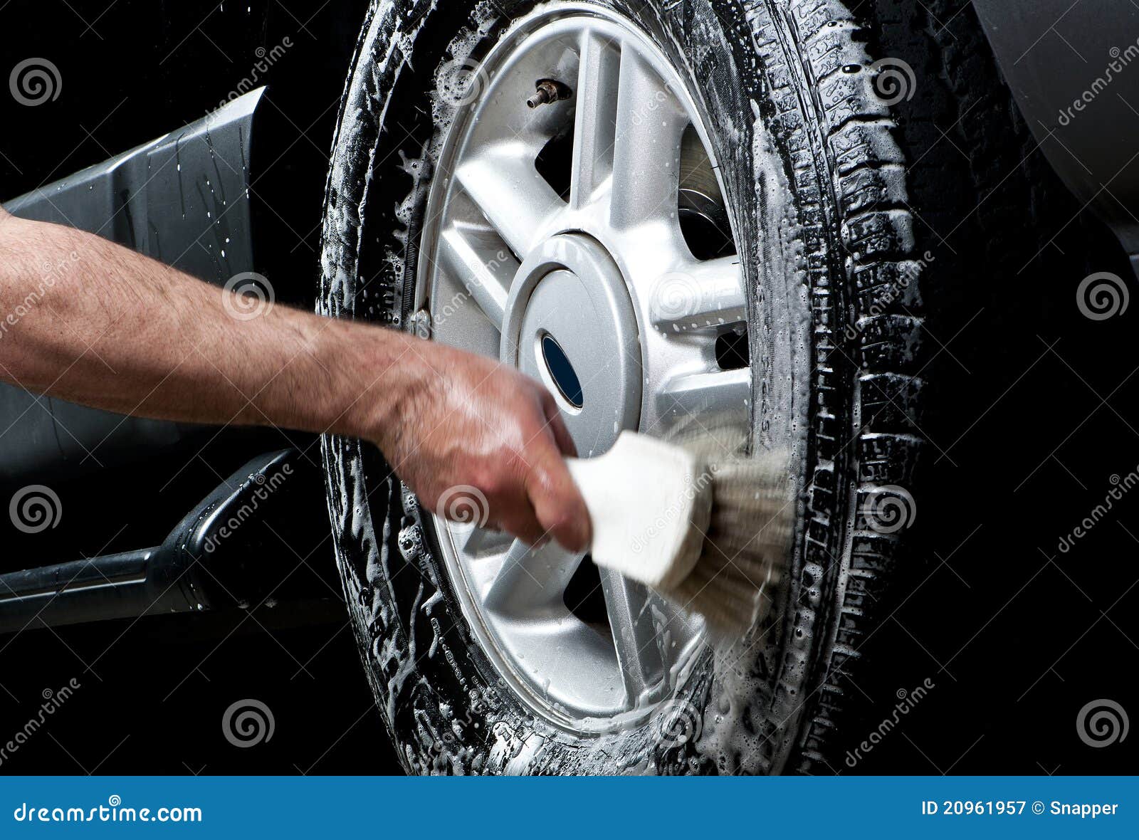 cleaning tire in a car wash