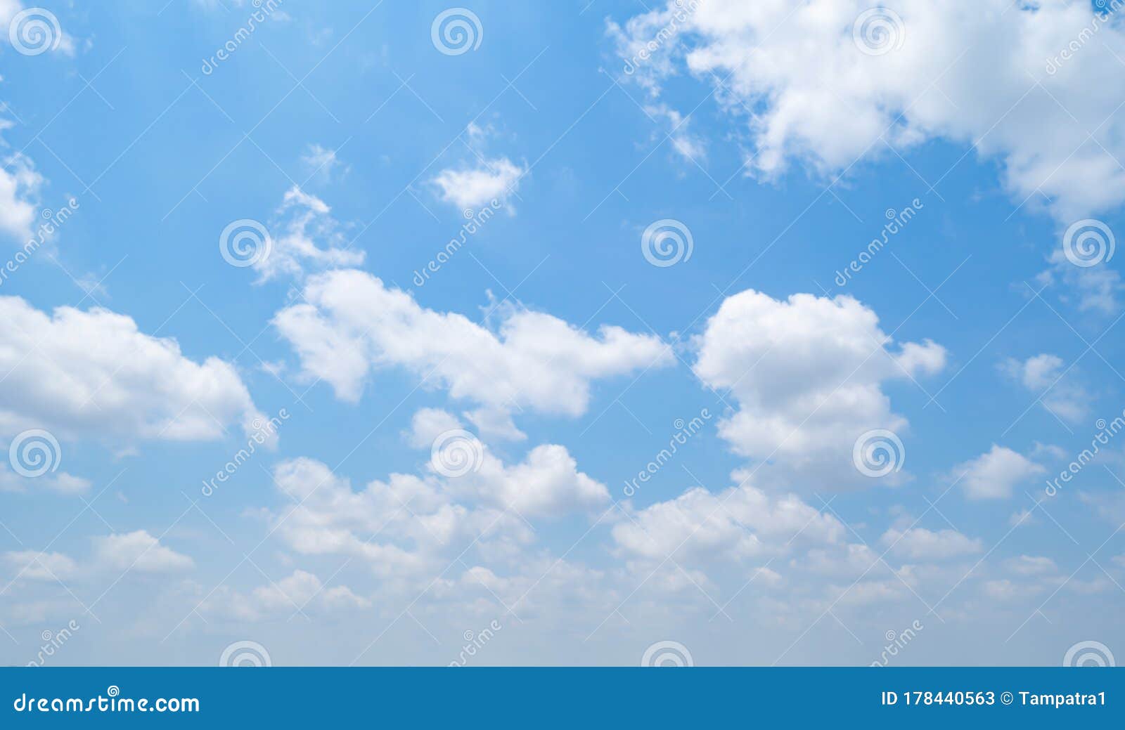 clear blue sky with white fluffy clouds at noon. day time. abstract nature landscape background