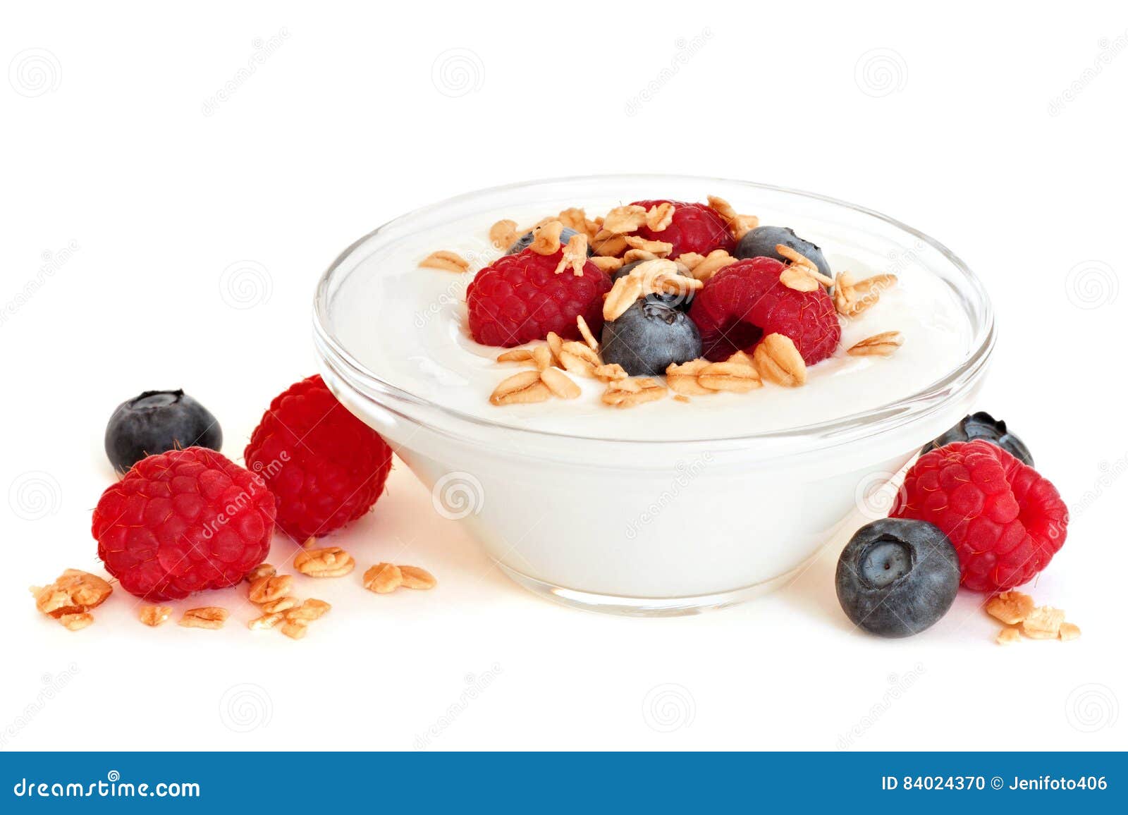 Clear Bowl Of Yogurt With Raspberries, Blueberries Over White Stock