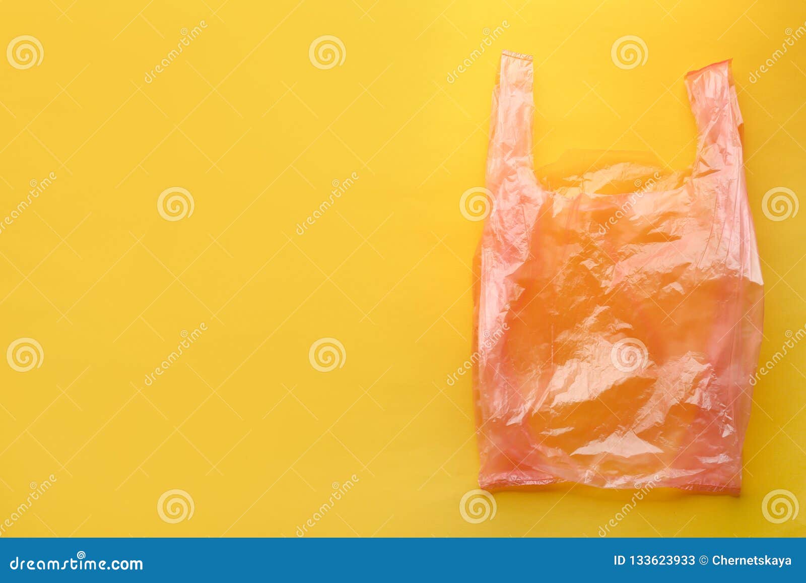 Clear Disposable Plastic Bag On Color Background. Stock
