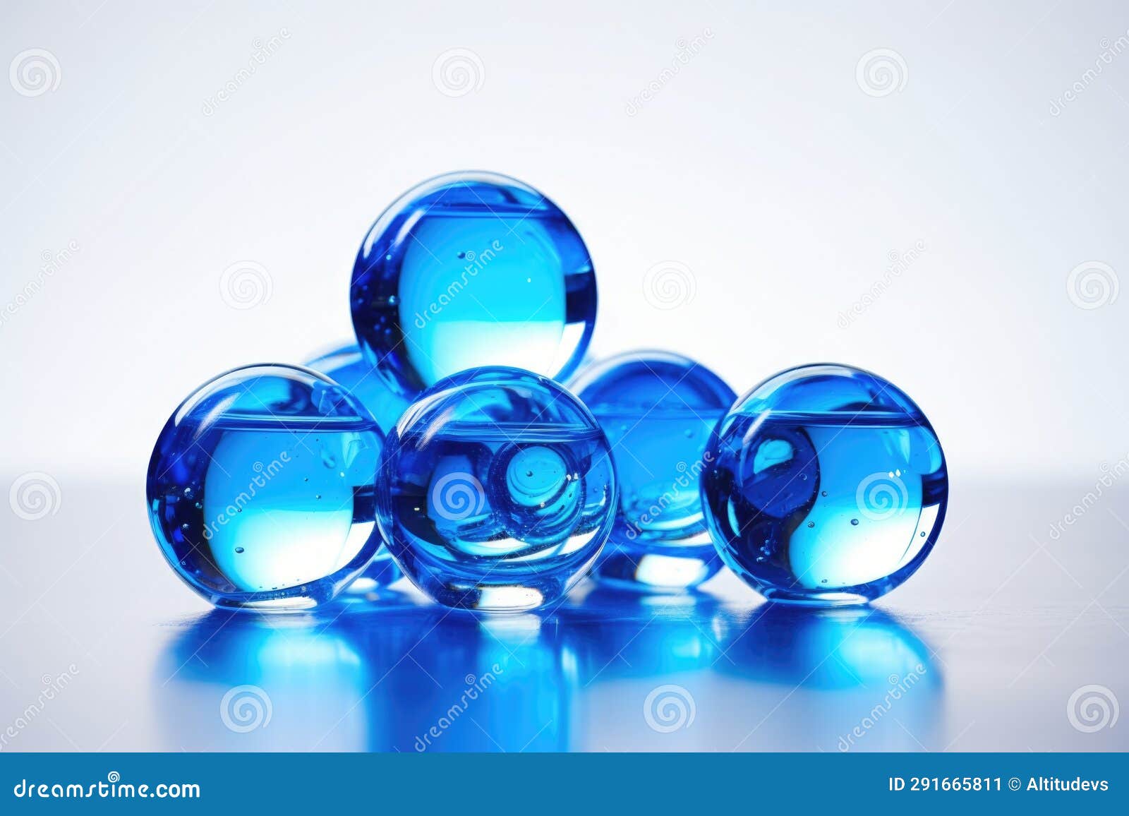 A Clear Glass Filled with Shiny Blue Marbles Stock Image Image of