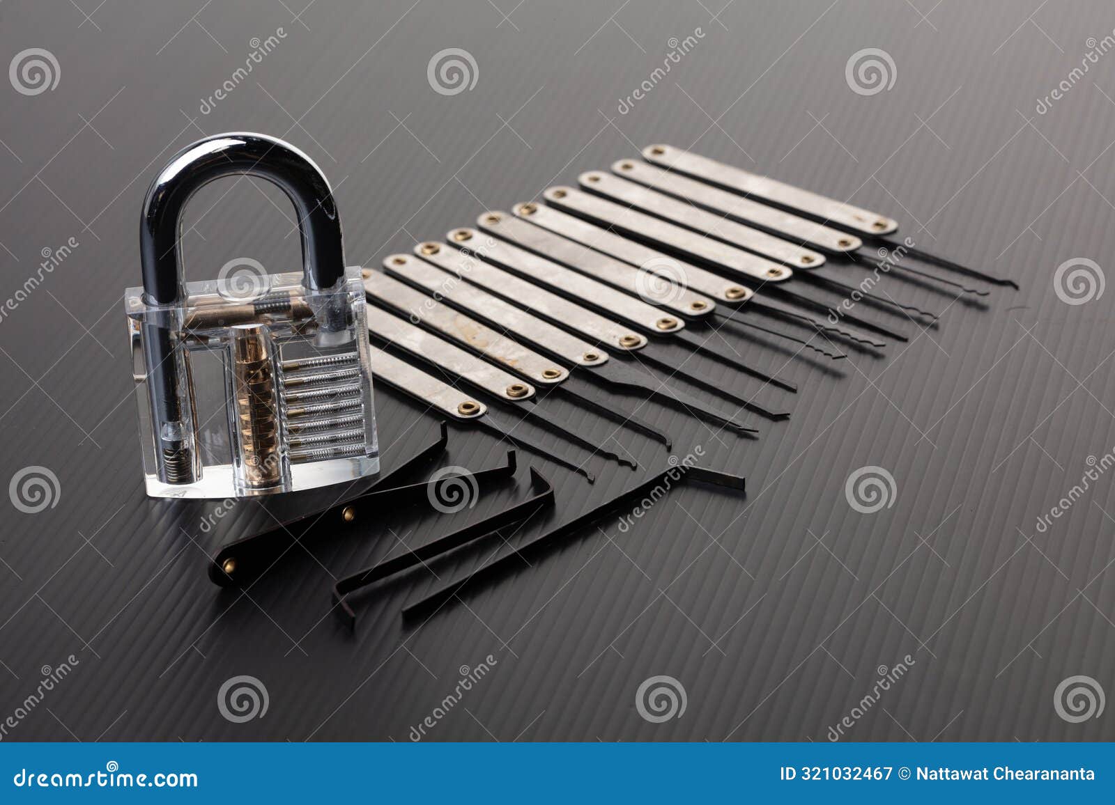 clear lock device over black background to show mechanic inside lock. many lock pick tool to unlock key of door window vehicle for