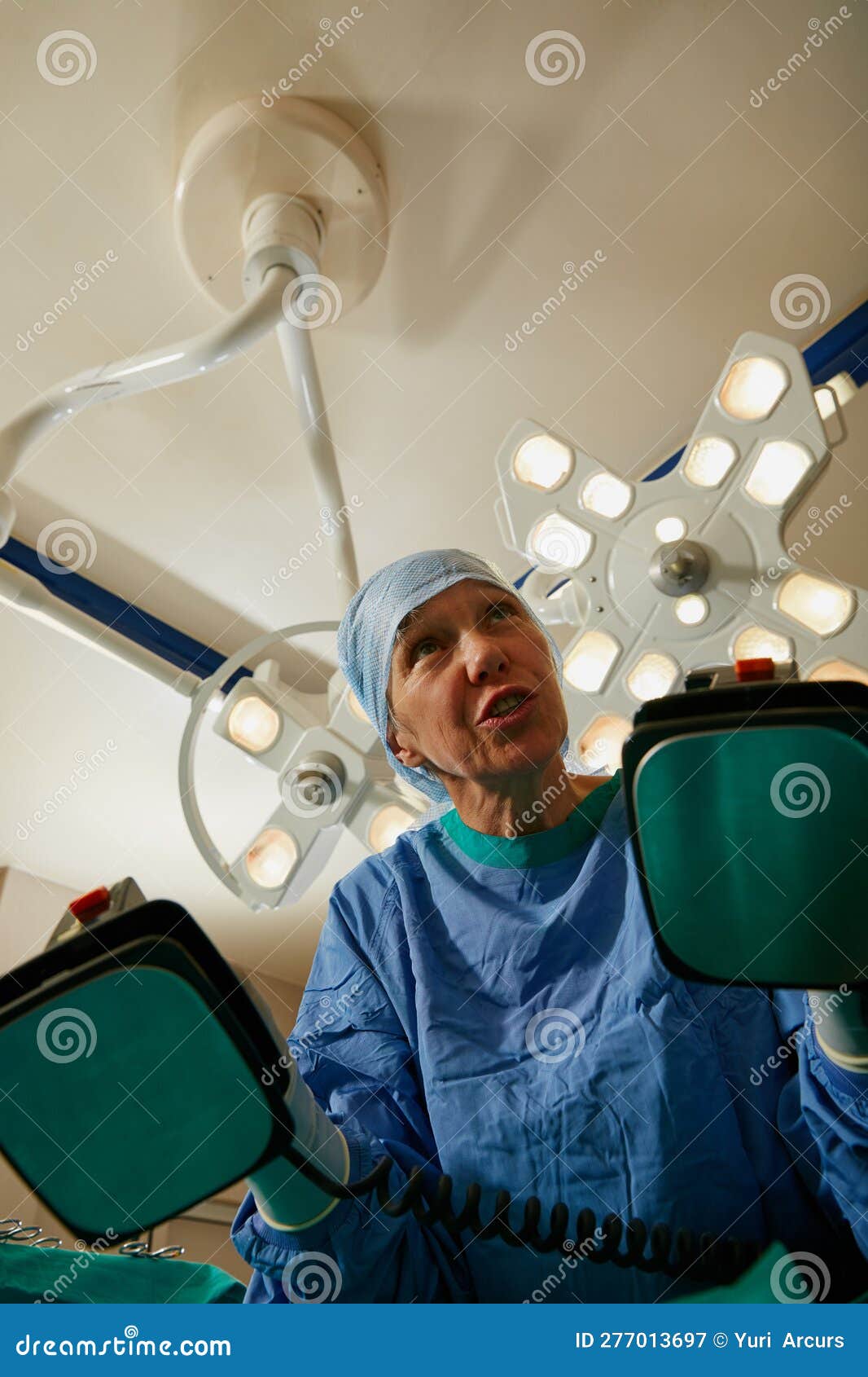 Clear. a Surgeon Using a Defibrillator during Surgery. Stock Image