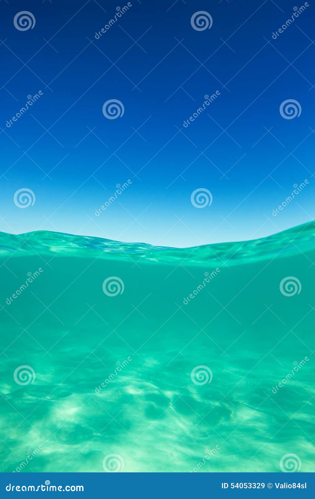 clear waterline caribbean sea underwater and over with blue sky