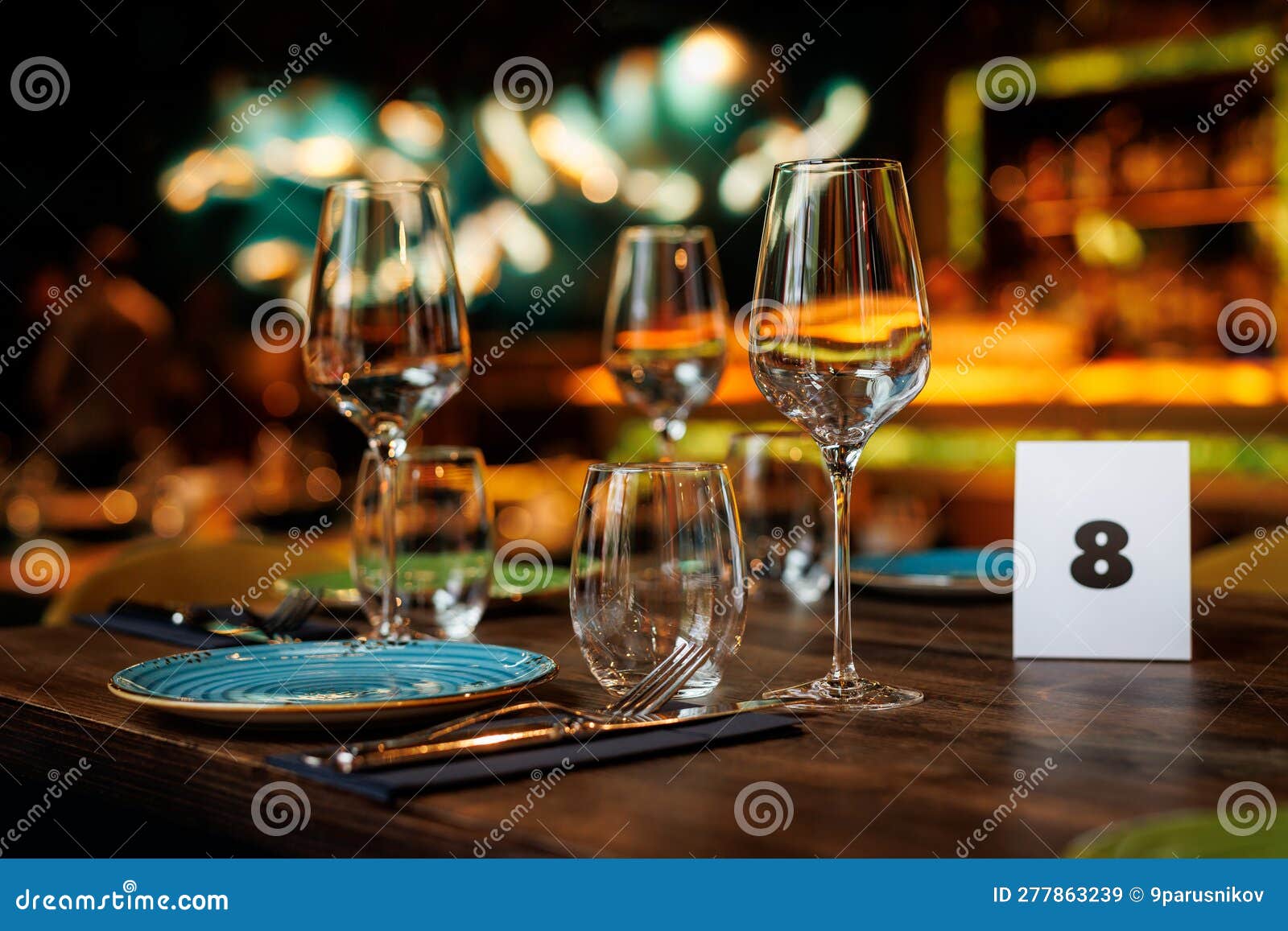 Clear Wine Glasses on a Wooden Table in a Restaurant. Stock Image