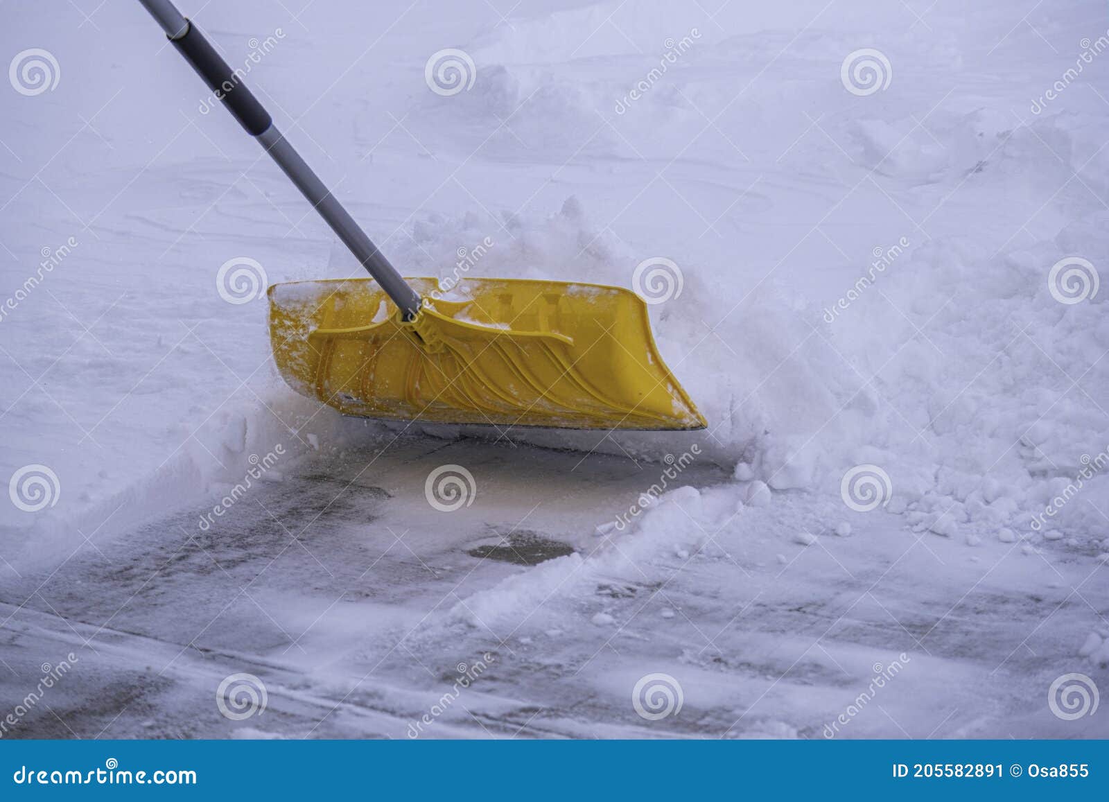 Clearing Snow from Driveway after Heavy Winter Storm Stock Image