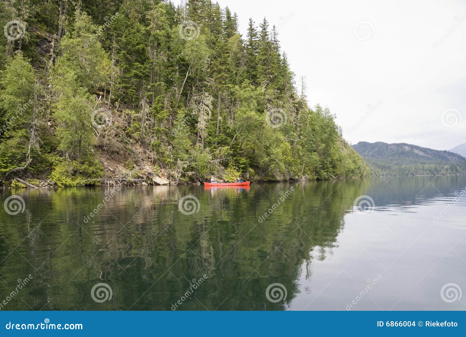 Clearwater lake with canoe stock photo. Image of nature 6866004