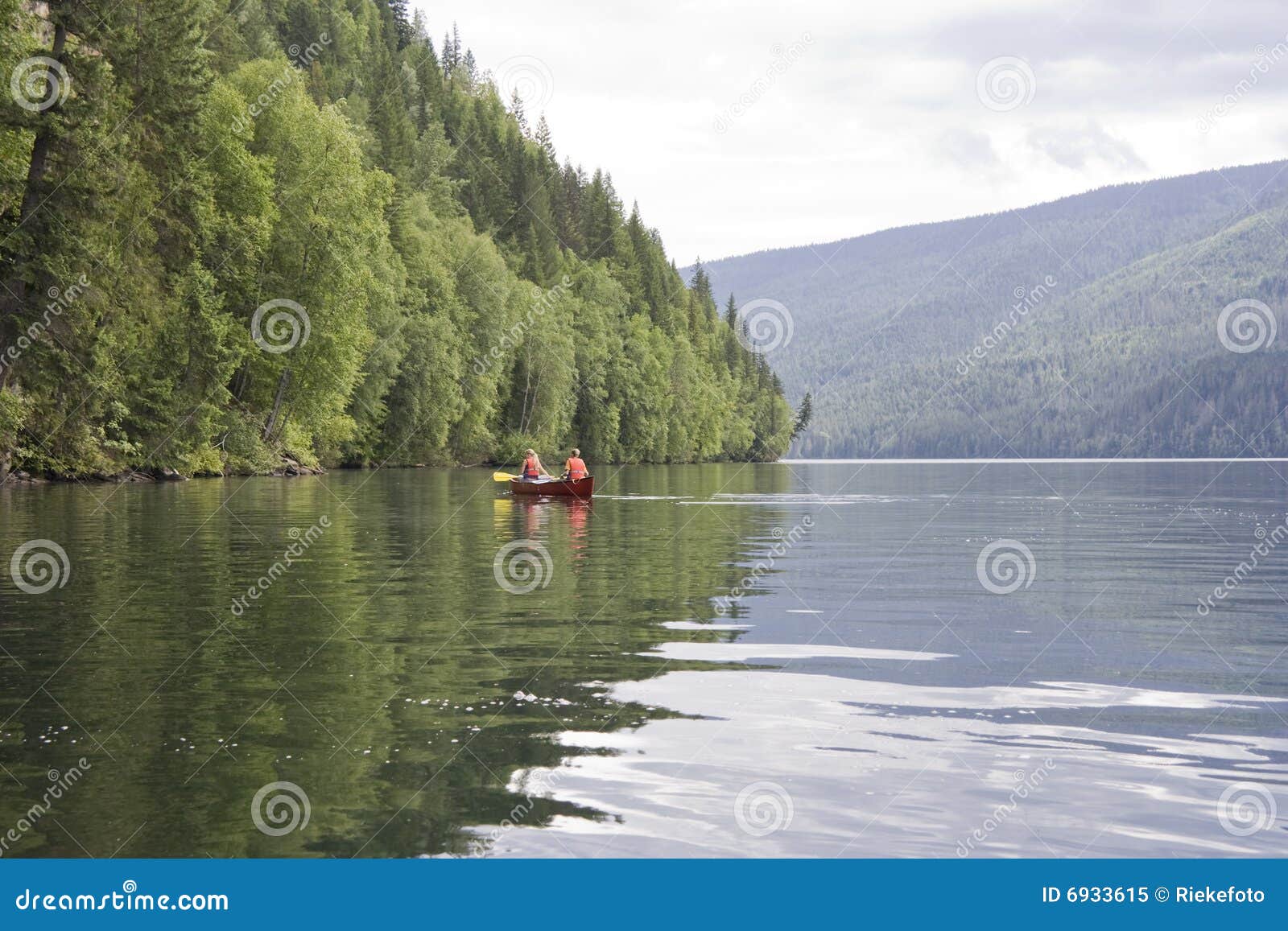 Clearwater lake with canoe stock image. Image of paddling 6933615